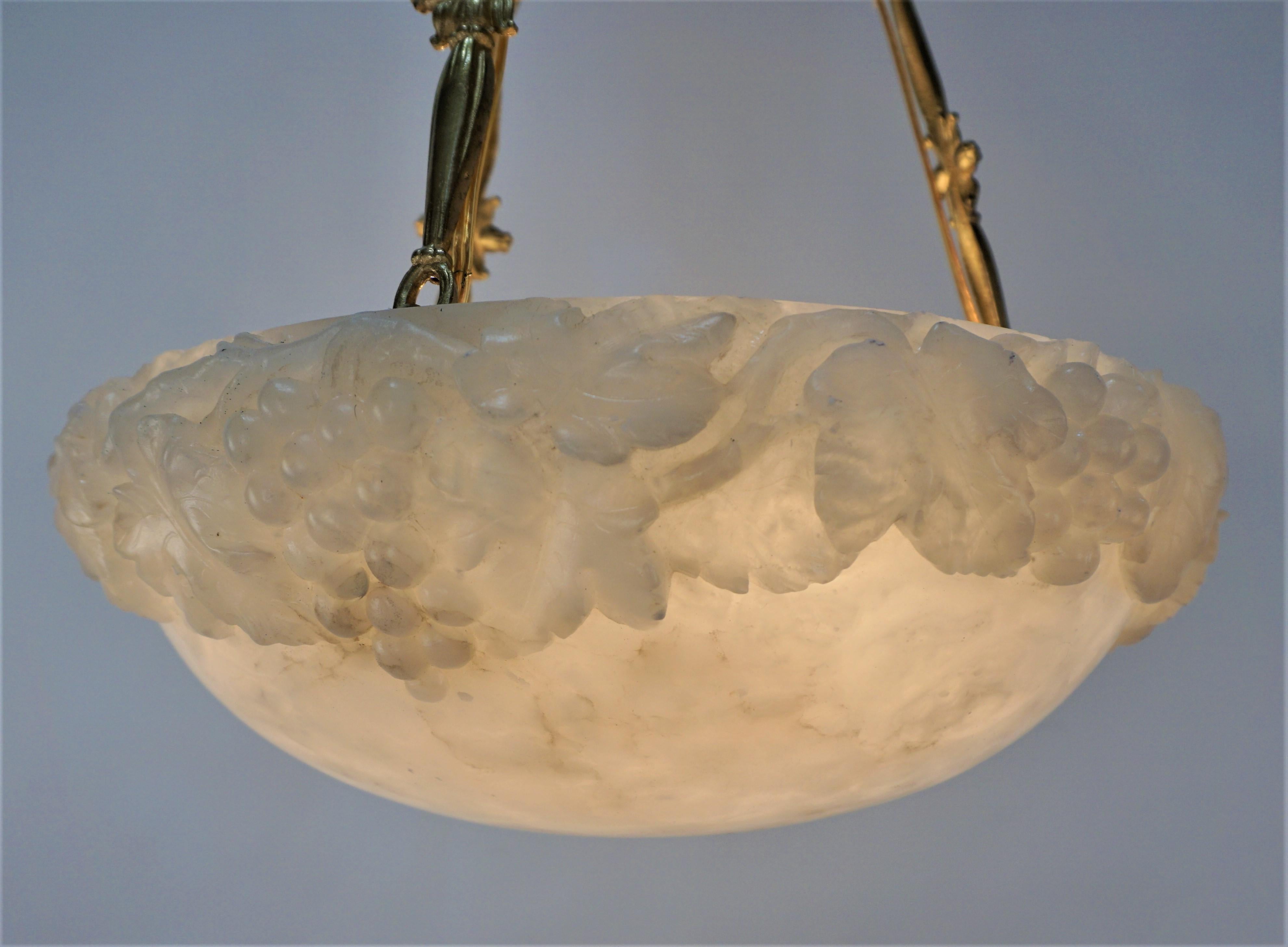 1920's carved alabaster chandelier with elegant bronze canopy and chain.
Six lights, 75 max each. 