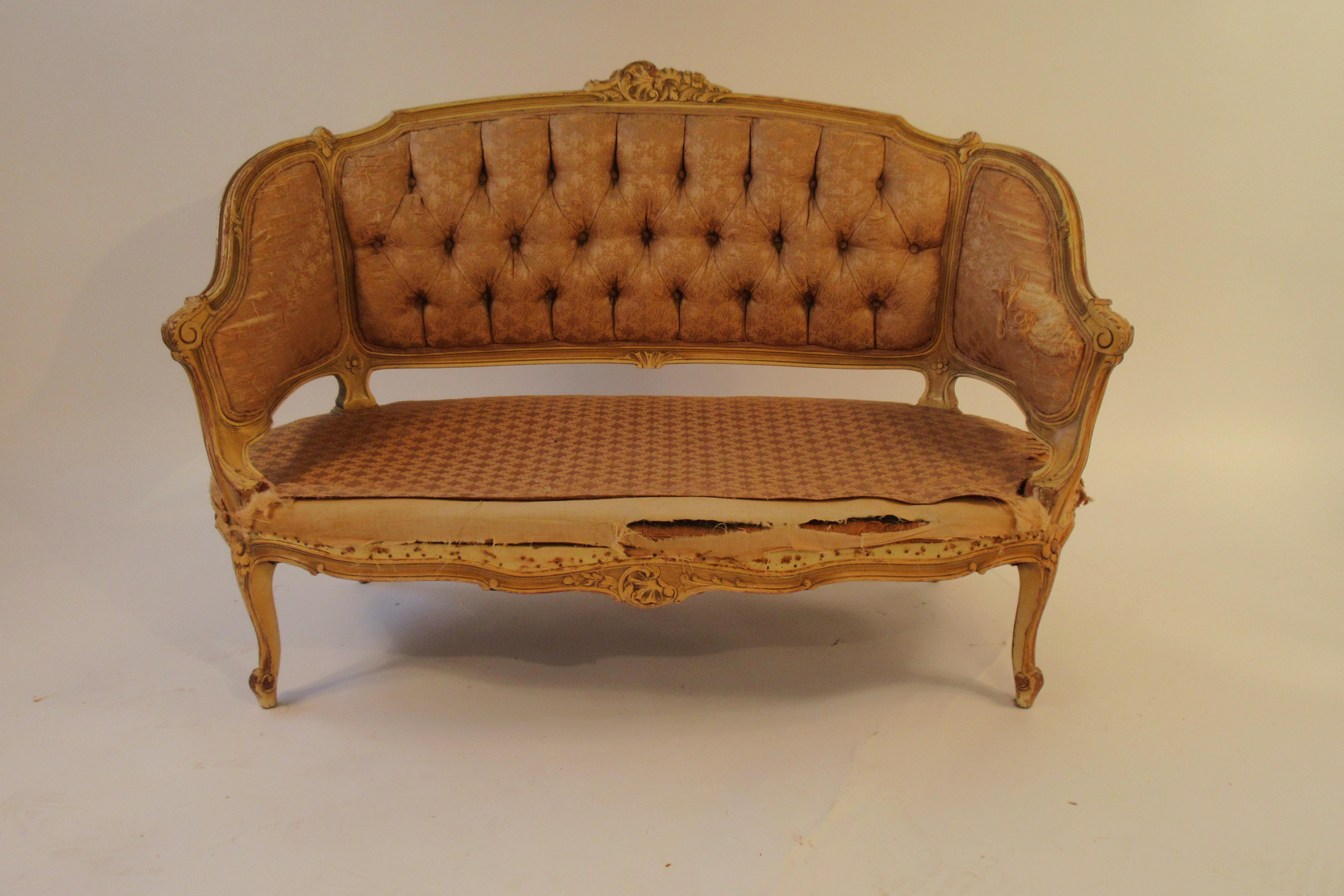 1920s carved wood French settee. Frame needs stripping and reupholstering.
