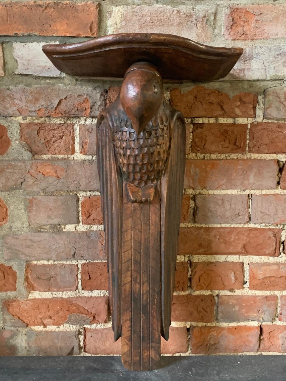 A nice early 20th century carved wood bracket shelf in the form of a Parrot. Circa 1920.