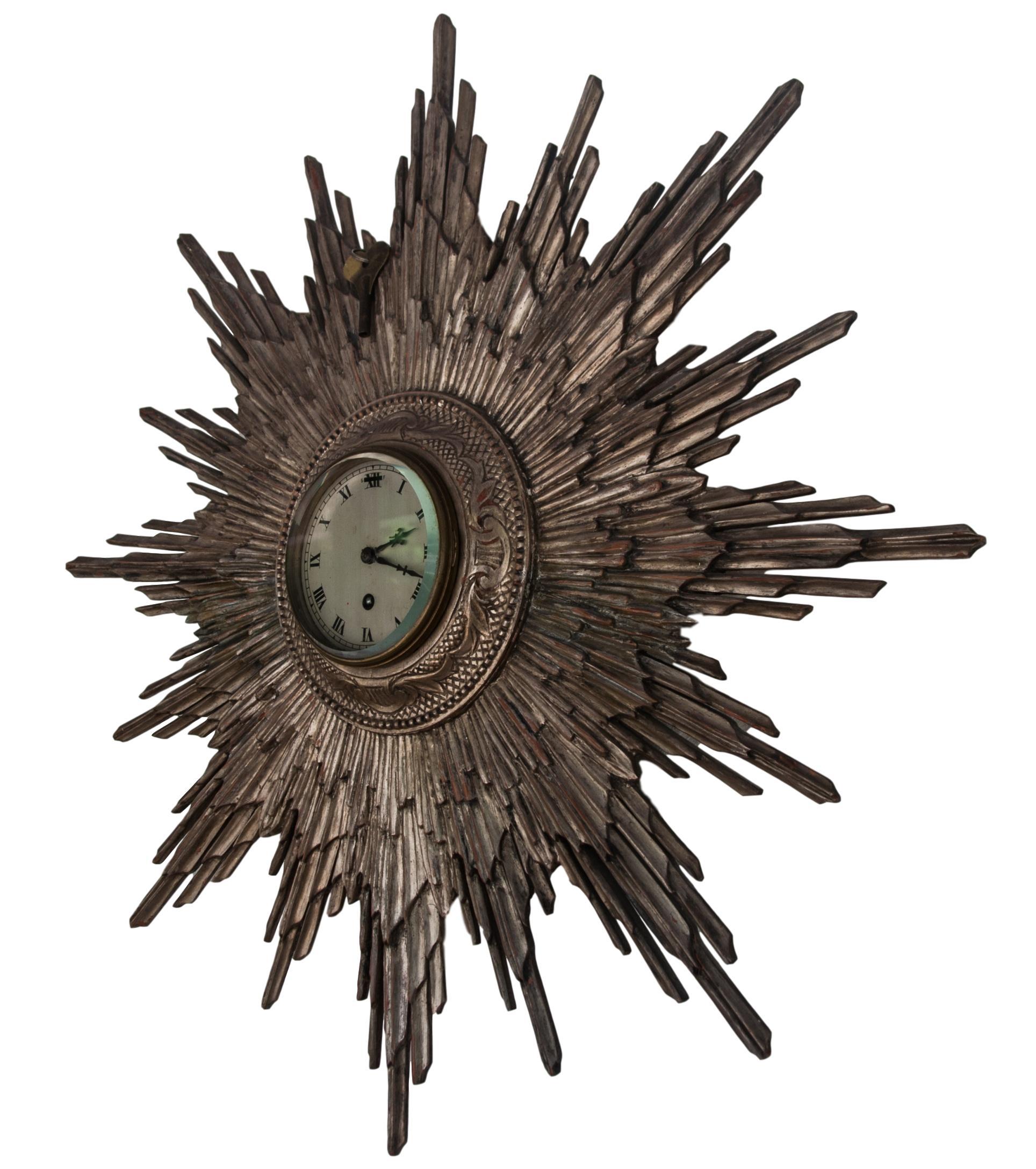 silver sunburst clock