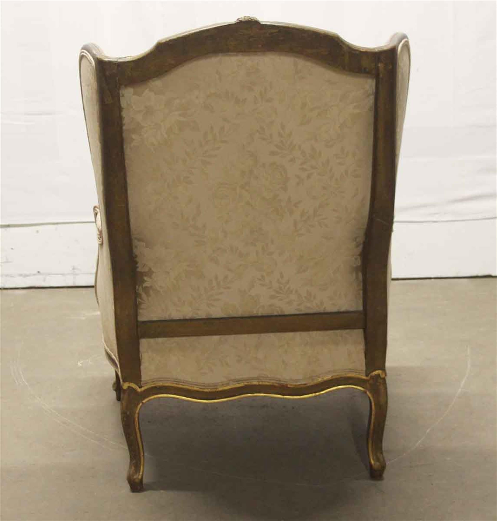 Early 20th Century 1920s Carved Wood Stuffed Wing Back Chair with Foral Cream Colored Upholstery