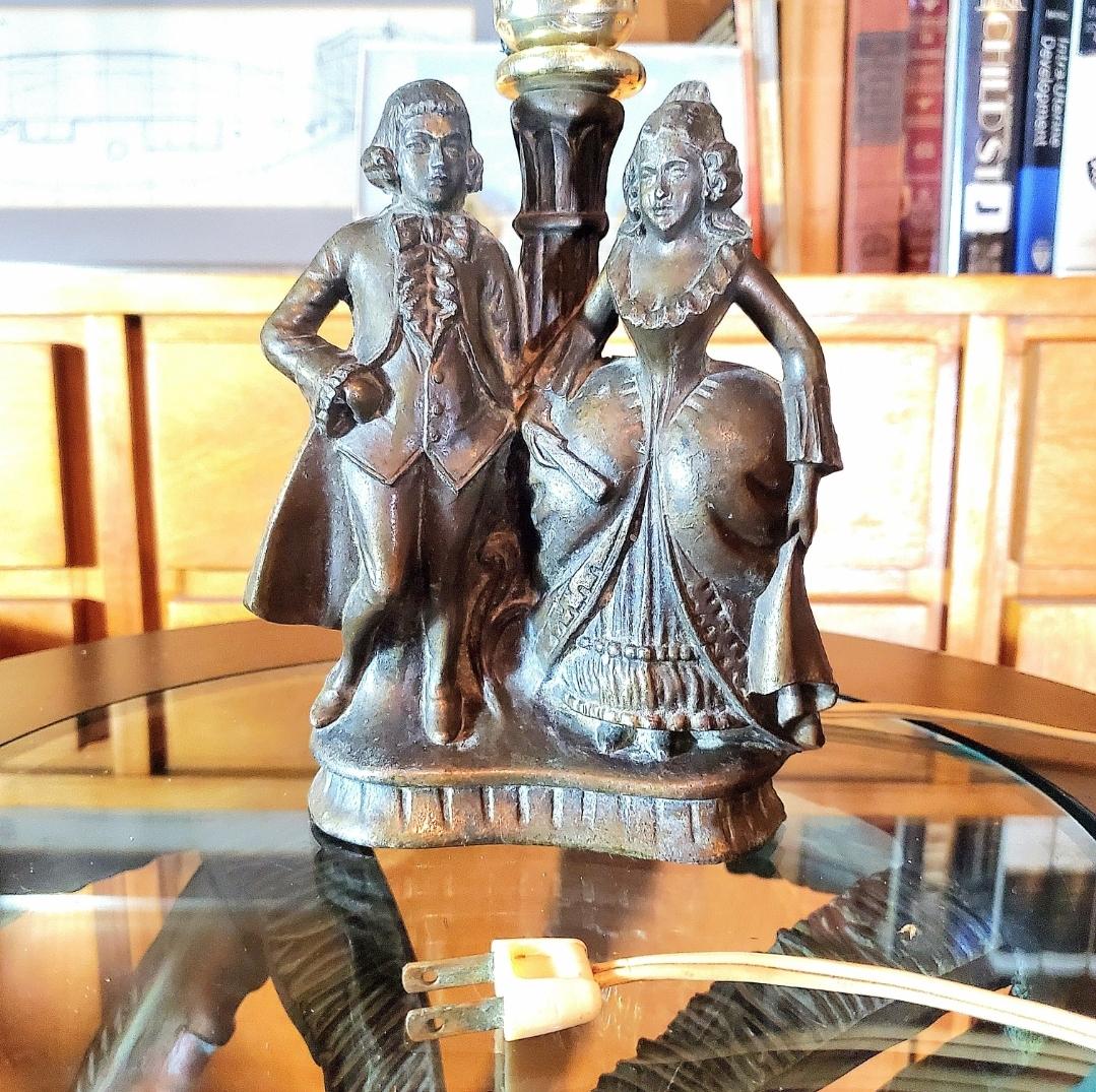 antique victorian man and woman lamps