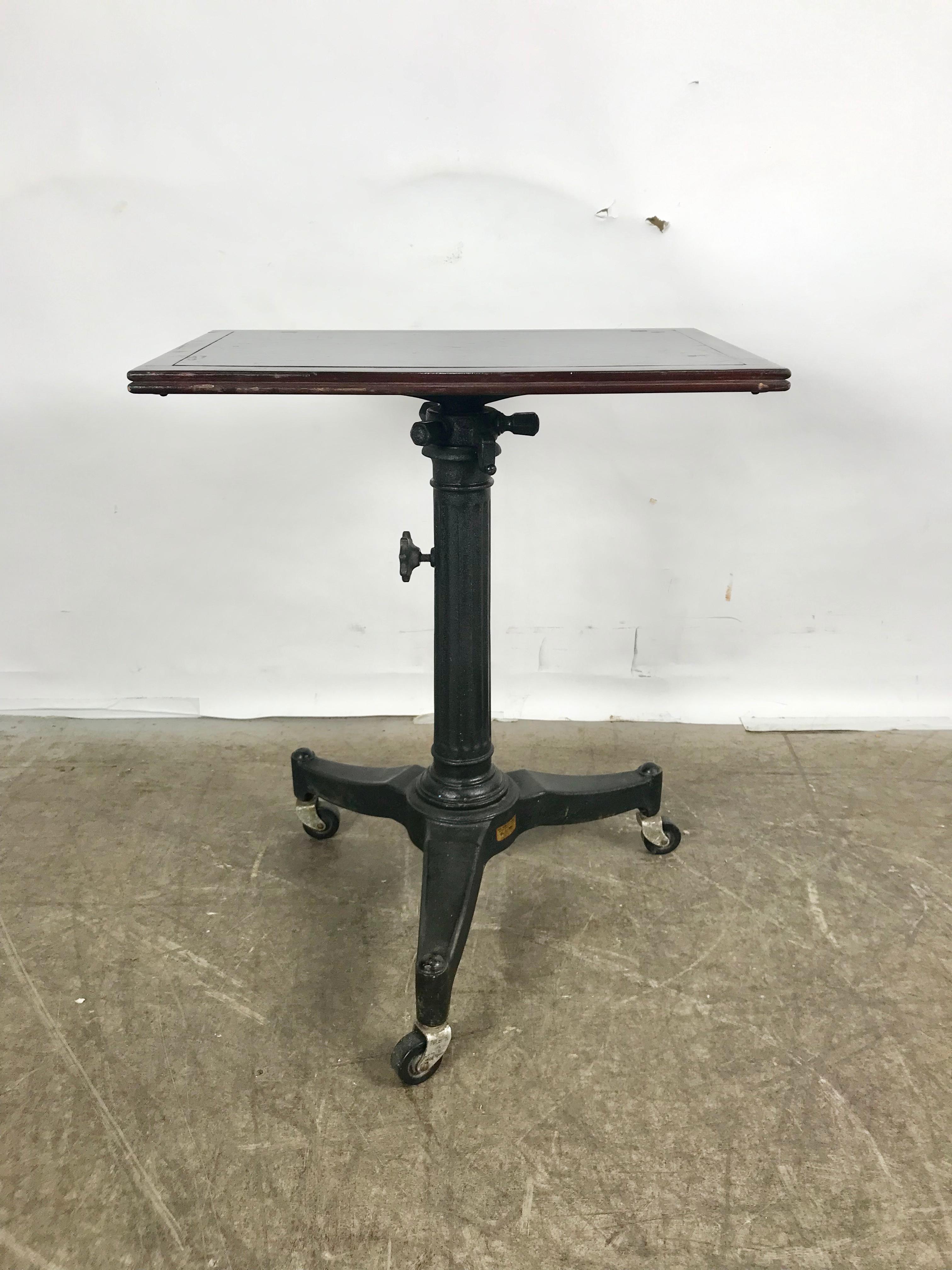 1920s Cast Iron and Wood Industrial Adjustable Table by Karl Manufacturing Co. In Good Condition In Buffalo, NY