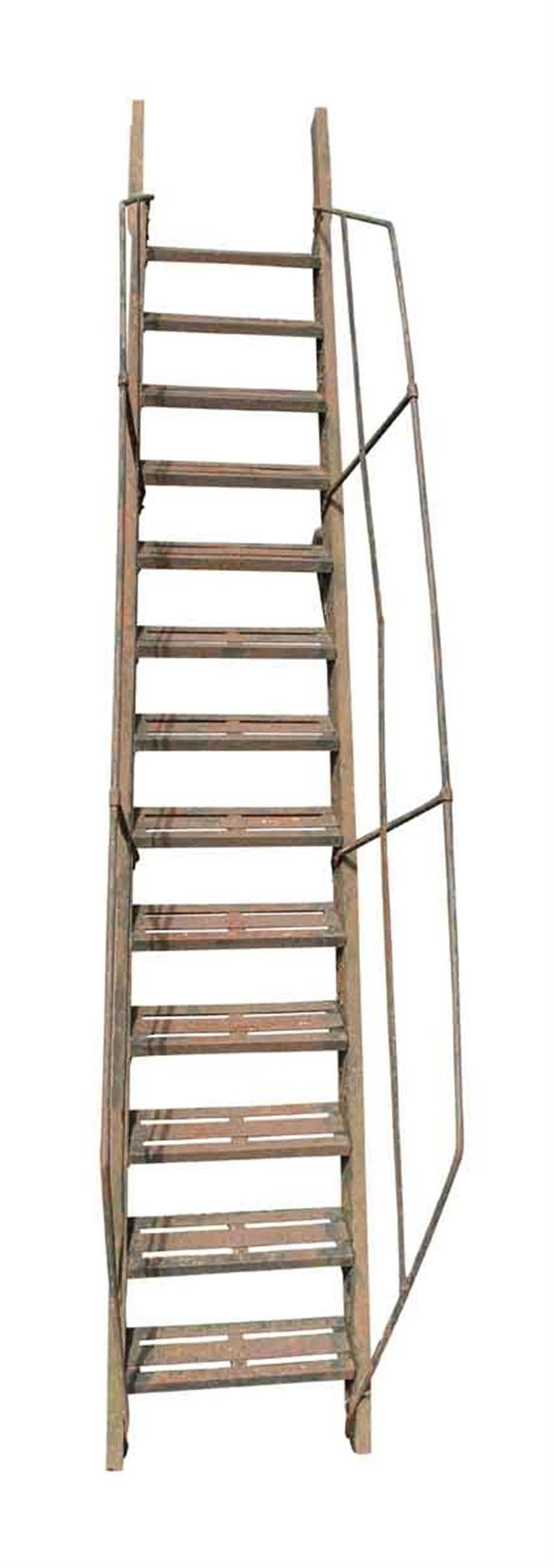 Heavy duty 1920s cast iron fire escape with hand rails. The stairs are sound and the overall condition is quite strong, with flaky black paint and rusted patina. This can be seen at our 400 Gilligan St location in Scranton, PA.