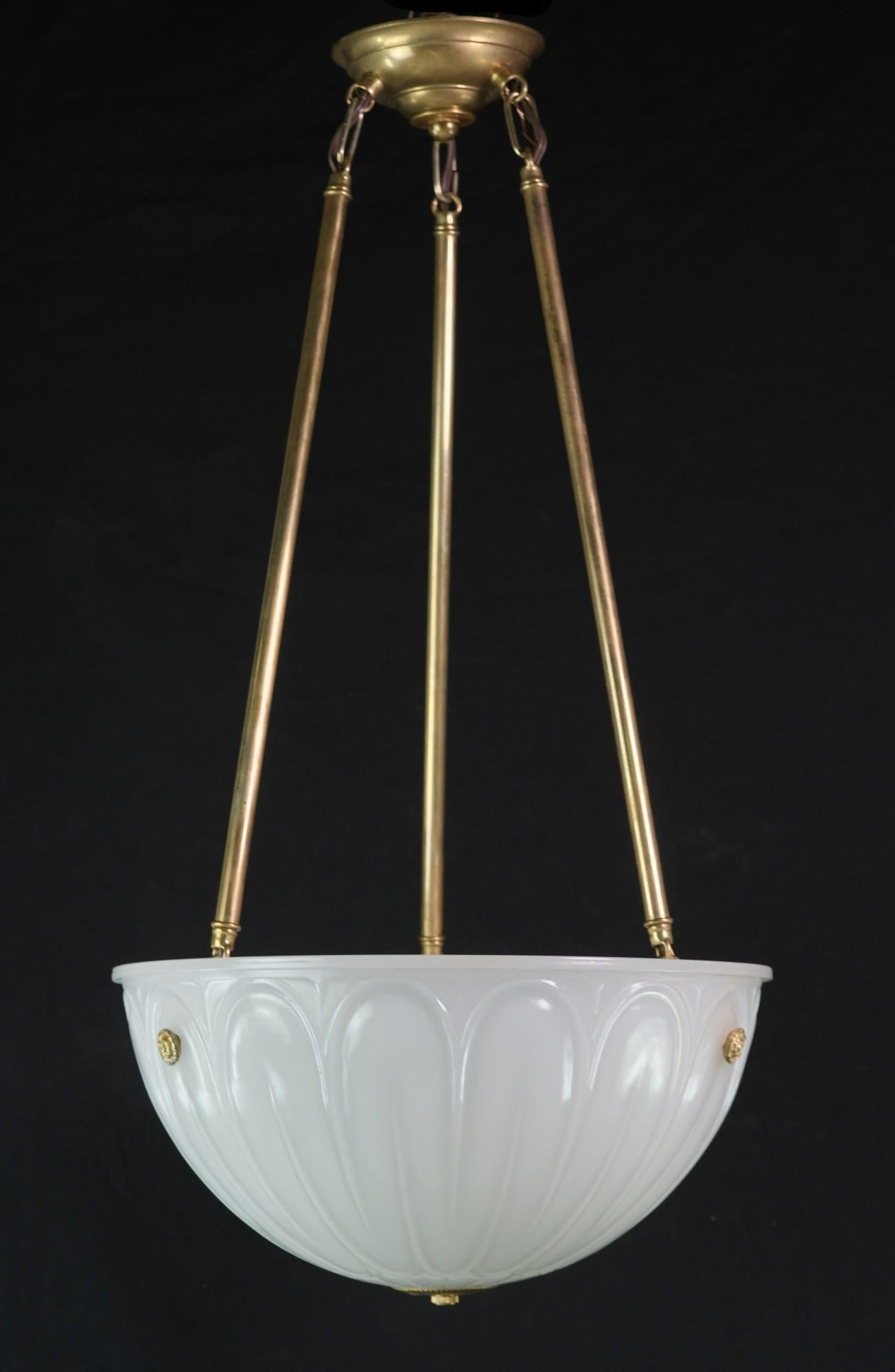 1920s cast milk glass opaque white dish pendant light with brass hardware. Including brass plated steel florets, poles, and canopy. Takes three E26 light bulbs. This can be seen at our 400 Gilligan St location in Scranton, PA.