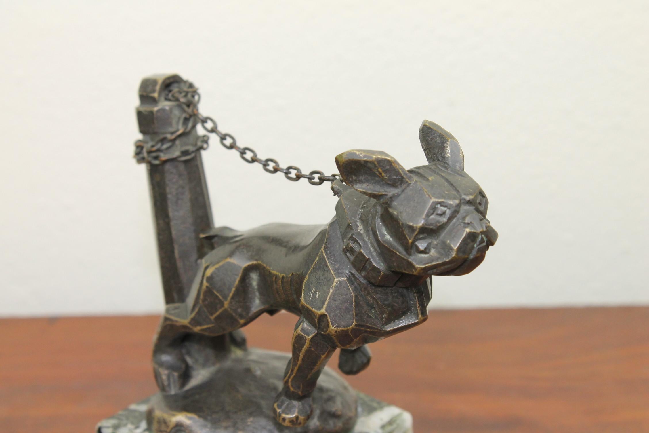 Unusual cubist hood ornament with French bulldog dog on the chain -
mounted on dark green , black and white veined Marble Base - Early 20th Century - 1920s - Art Deco Figurine - Art Nouveau Figurine . 
Art Deco Statue - Mascot - Radiator Cab -