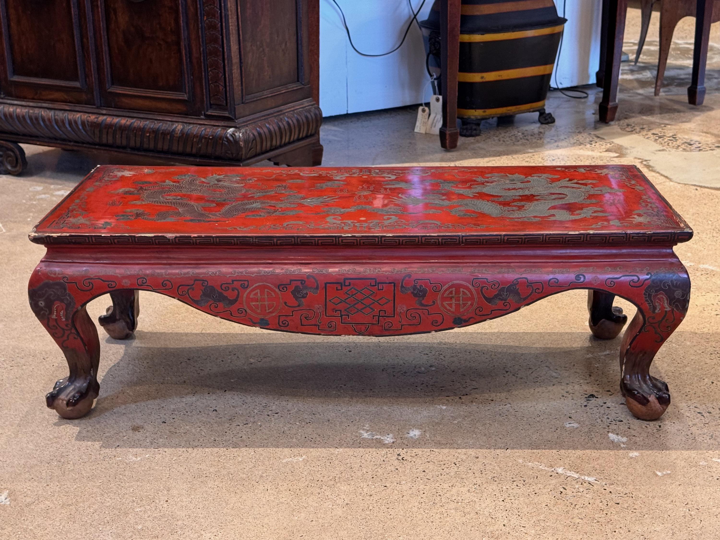 A very low decorated Chinese hardwood table. The red is very nice.