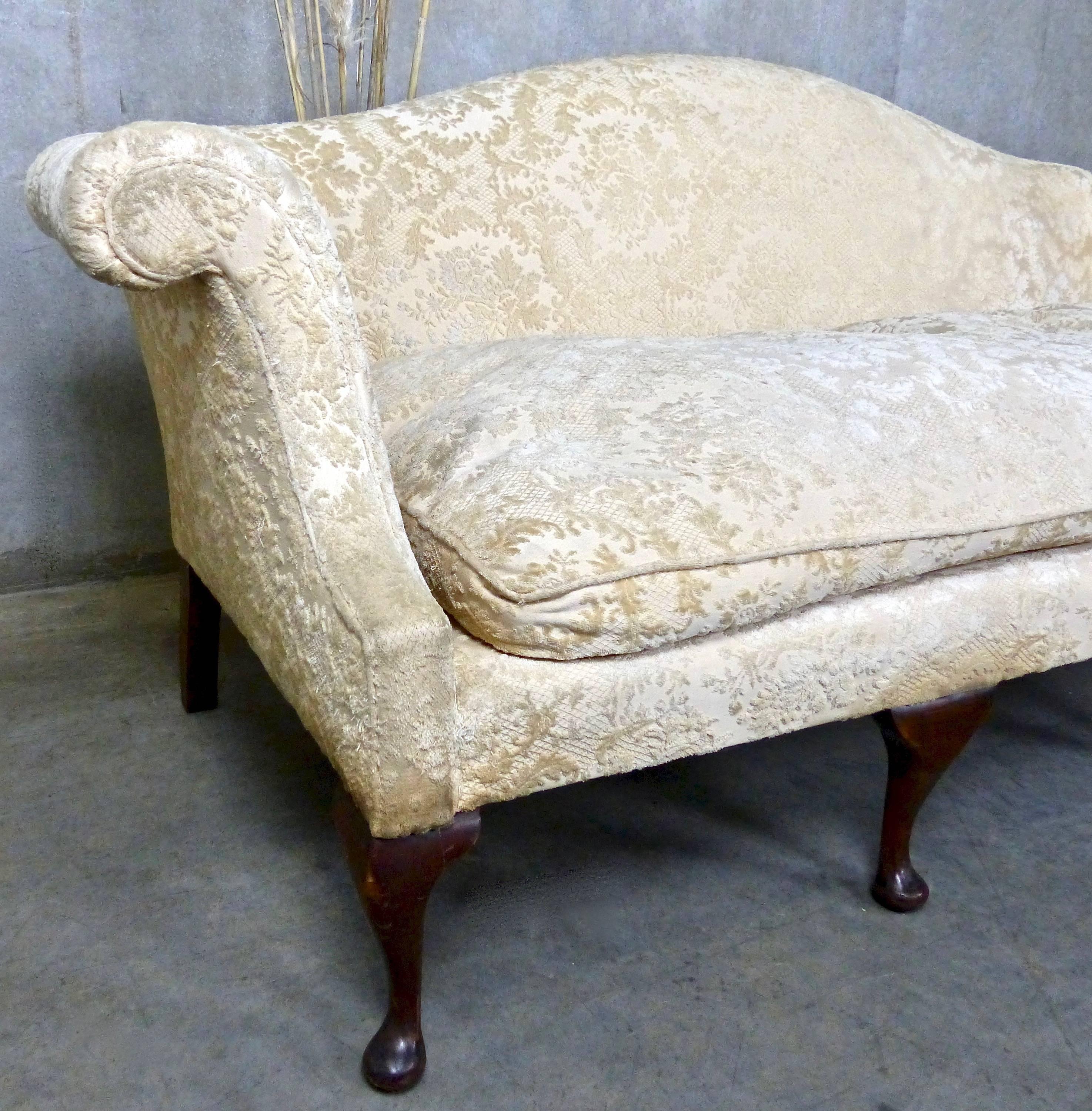 Chippendale Revival sofa with characteristic camel-shaped back and cabriole legs. Currently upholstered in an early and luxurious cut velvet that’s been well loved by its original NYC owners.
Four cabriole legs in front; two straight legs in back.