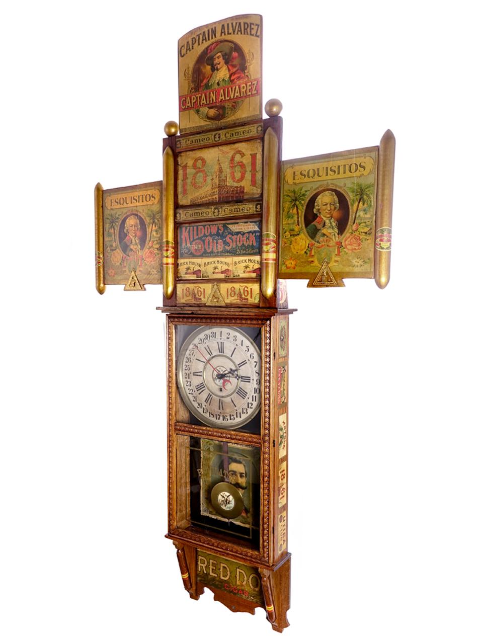 The center of this amazing advertising display is a 1920 Gilbert Observatory 8 day 1/2 hour strike clock. It's make an impressive display that is almost 6 foot tall. This clock was created between 1920 and 1930. It has been preserved back to as