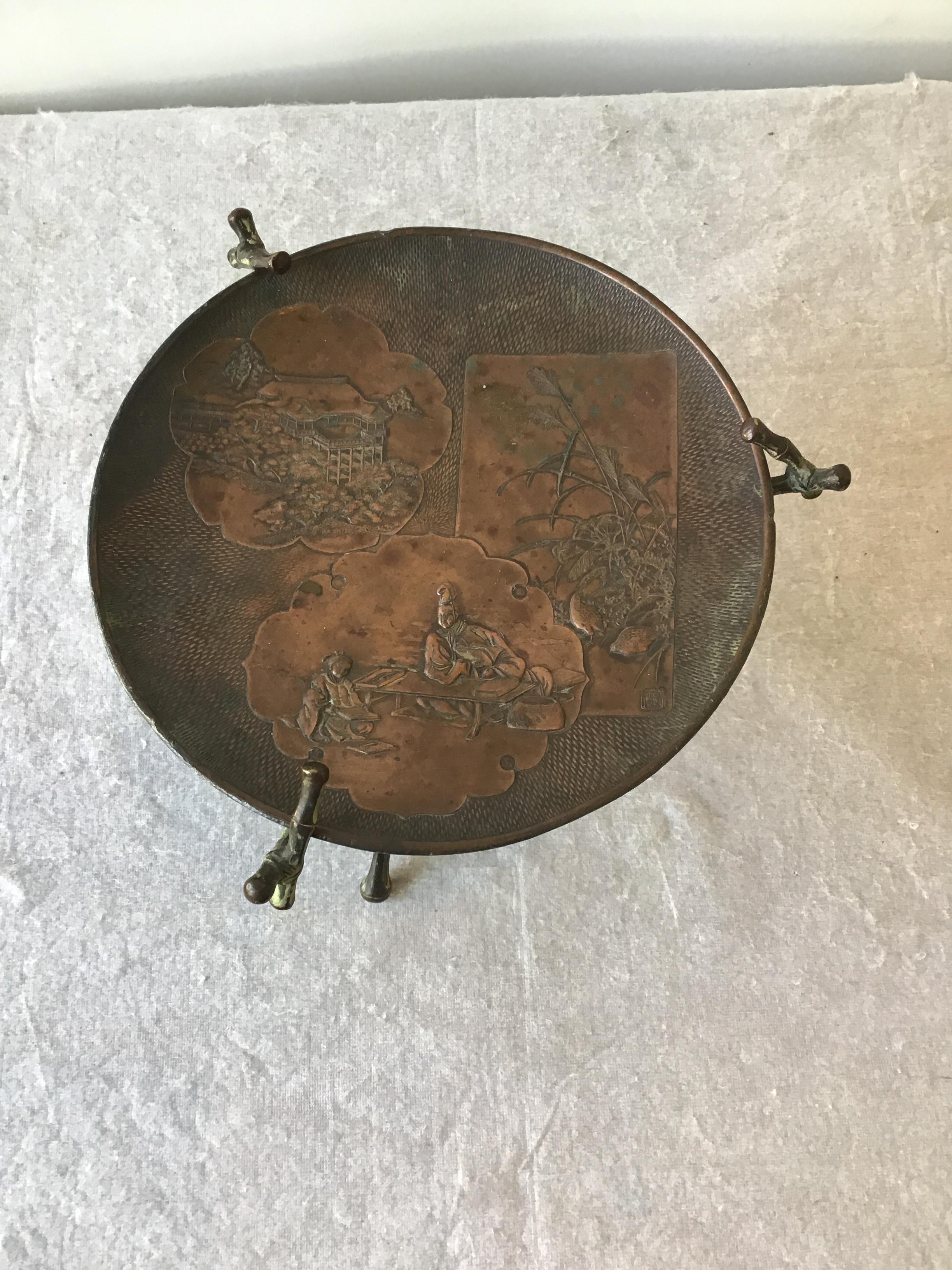 Early 20th Century 1920s Copper Stamped Dish Or Disc With Patina On Copper Faux Bamboo Stand For Sale