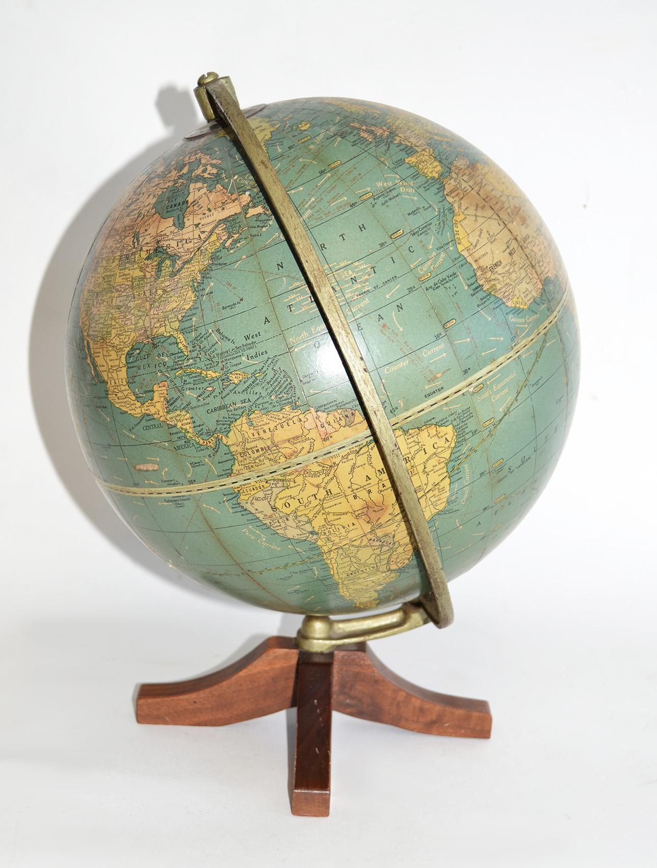 1920's Cram's Universal Terrestrial Globe 10.5 Inch on Walnut Base
Hard-to-find globe on cruciform walnut pedestal. Perfect for map geeks or science object collectors, bookshelves and desktops. Some losses to surface in the Pacific area. Fascinating