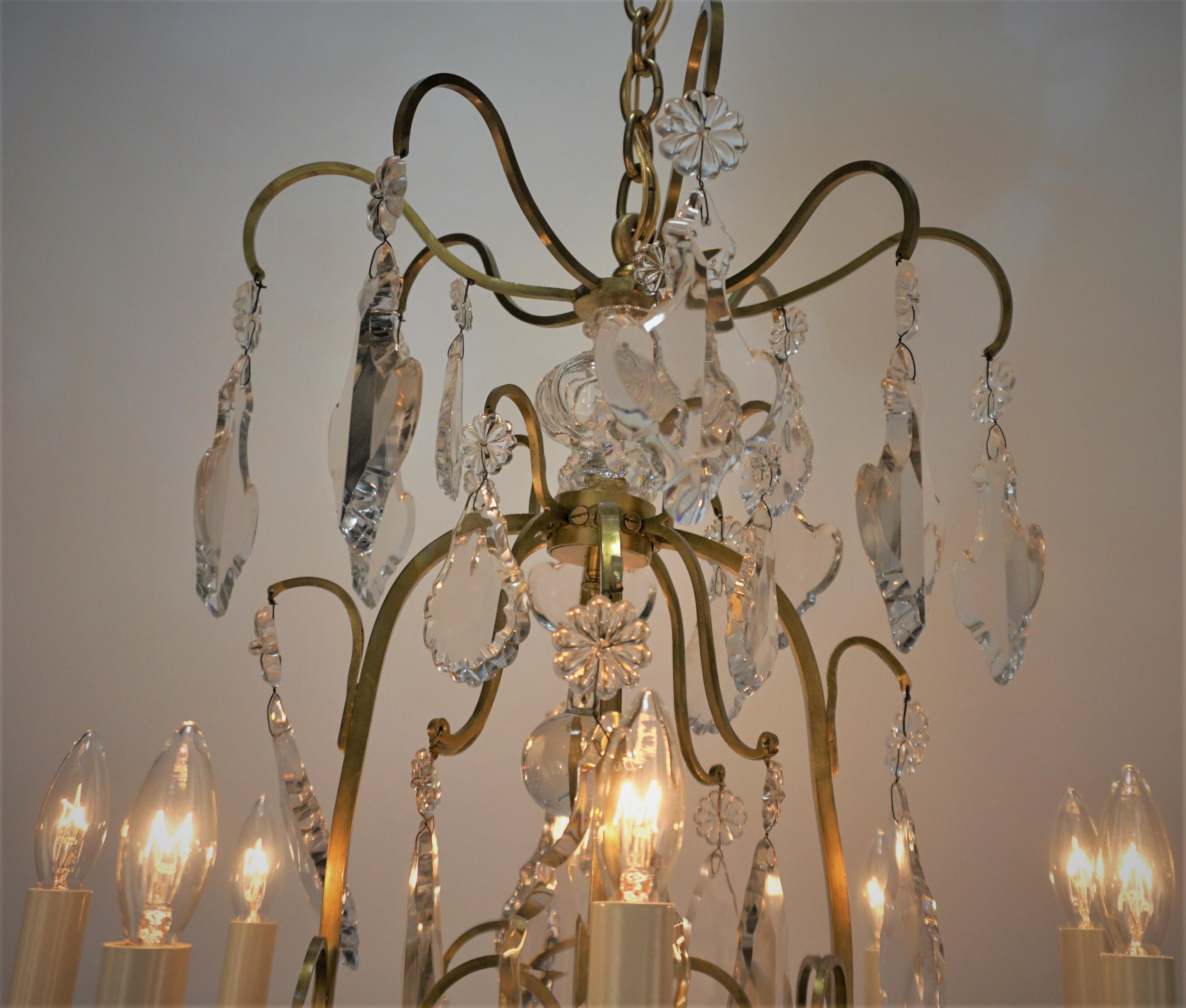 French 1920's Crystal and Bronze Nine Light Chandelier For Sale
