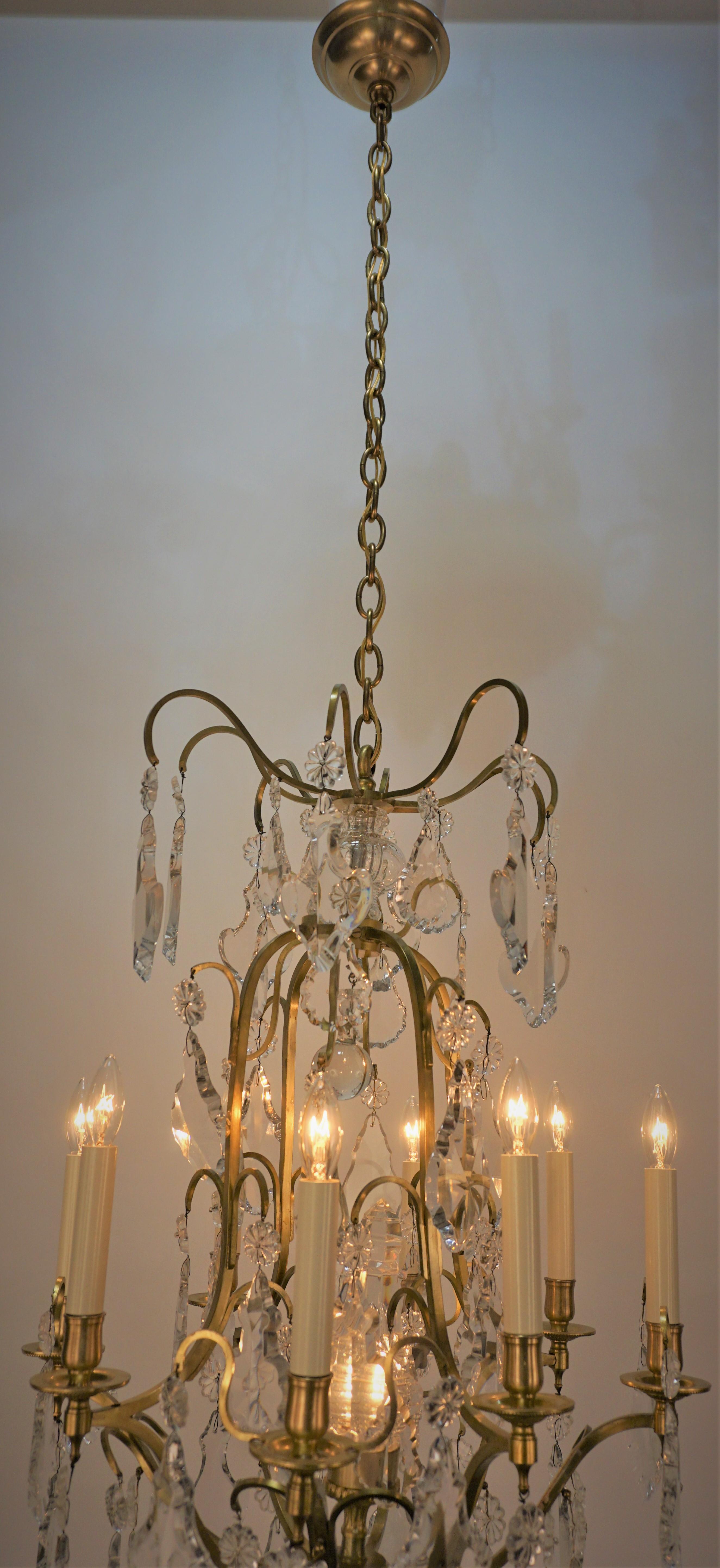 Early 20th Century 1920's Crystal and Bronze Nine Light Chandelier For Sale