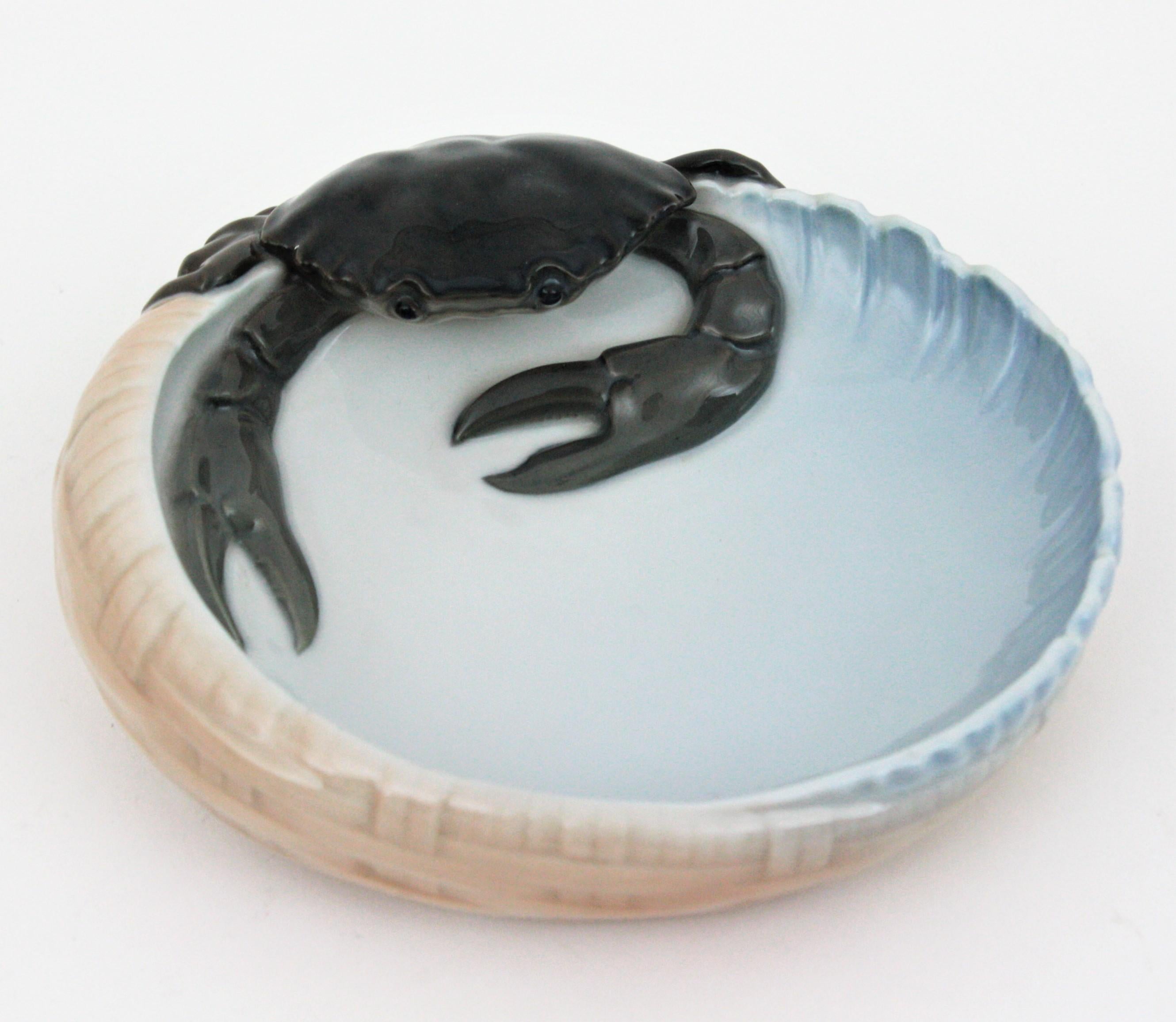 An amazing Royal Copenhagen porcelain basket bowl, dish or ashtray with a highly decorative crab figurine. Denmark, circa 1923.
This piece is in excellent condition and it is stamped with the manufacture's marks on the back.
Useful as jewelry