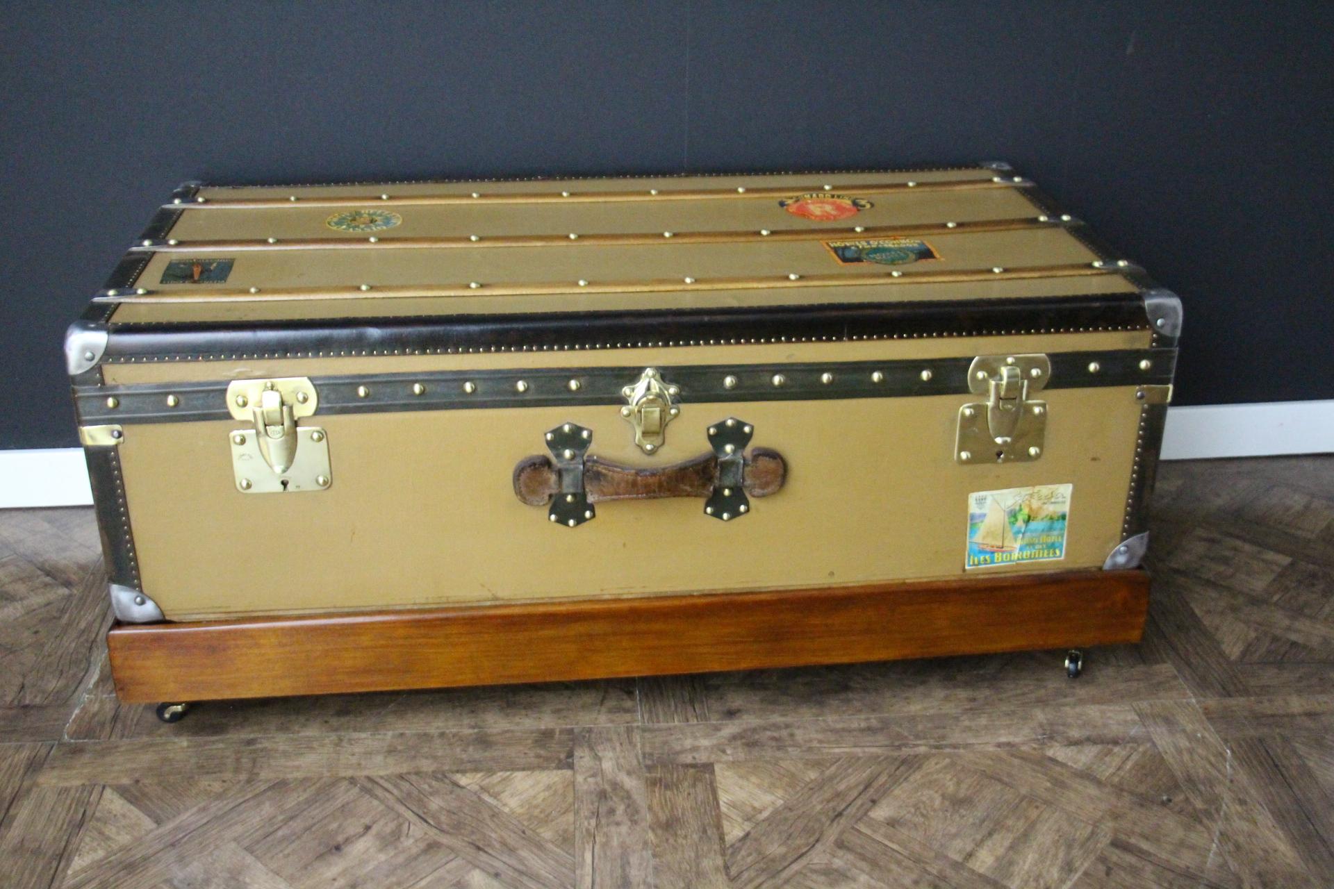 This beautiful Moynat steamer trunk features golden toffee color canvas, chocolate brown leather trim and side handles  It also has solid brass clasps and 2 locks.
Its main locks are marked 