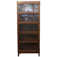 Antique 1920s Dark Wood Tone Five-Section Barrister Bookcase with Pull Out Glass Doors