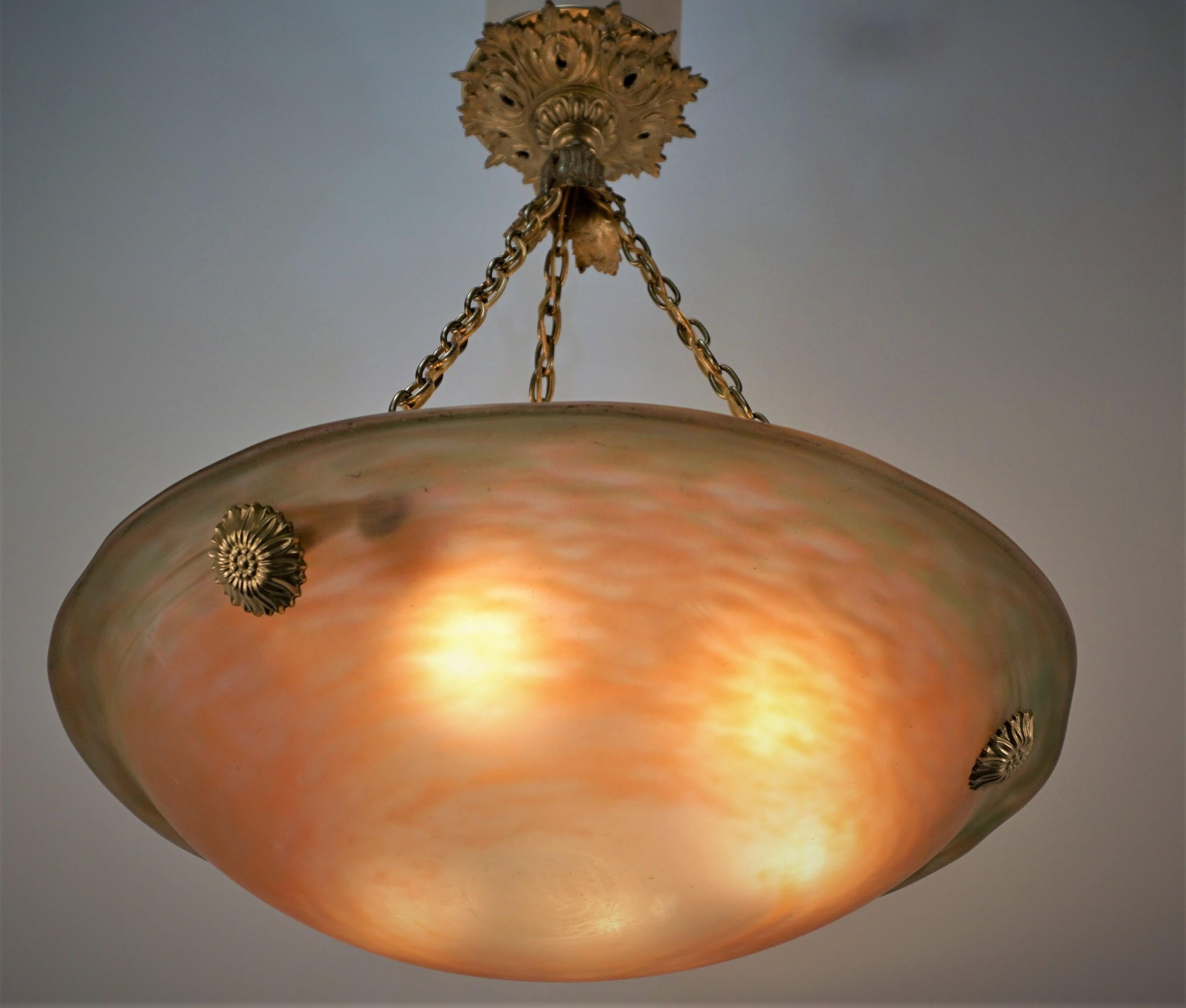Beautiful multi color blown glass chandelier with bronze hardware.
Professionally electrified with six light sockets.