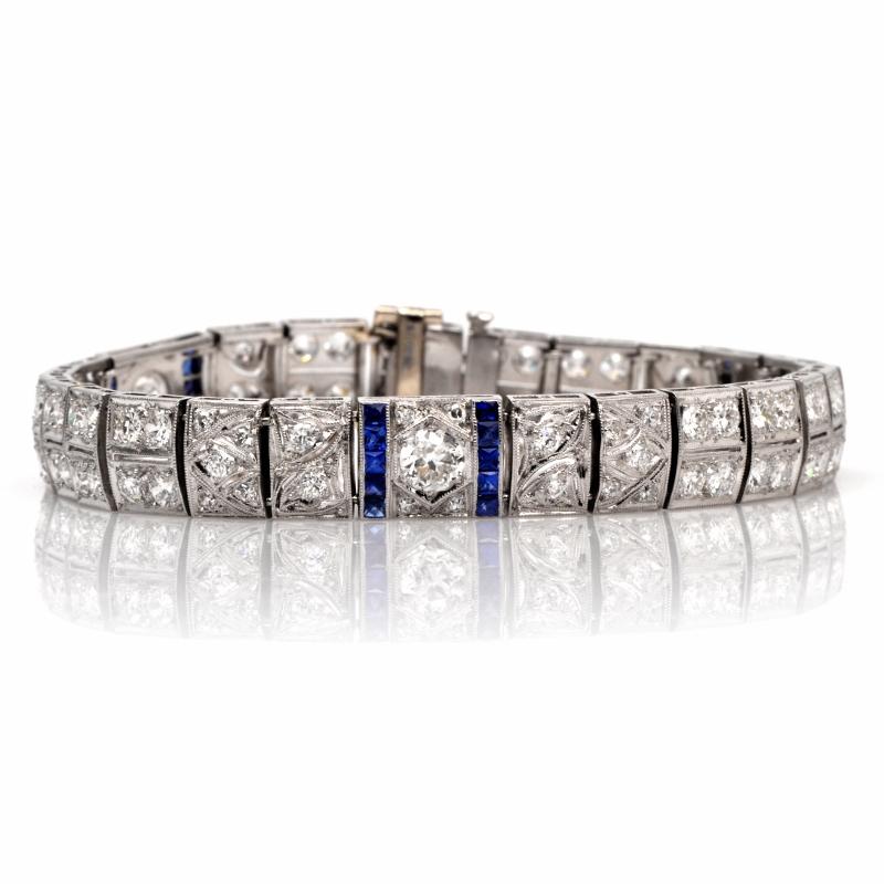This elegant Antique Are Deco Platinum bracelet is set with 3 larger genuine old European cut Diamond approx: 1.35 carats in total , F-G  color, VS1 clarity, prong set and adorned with 94 genuine old European cut round European cut Diamonds approx: