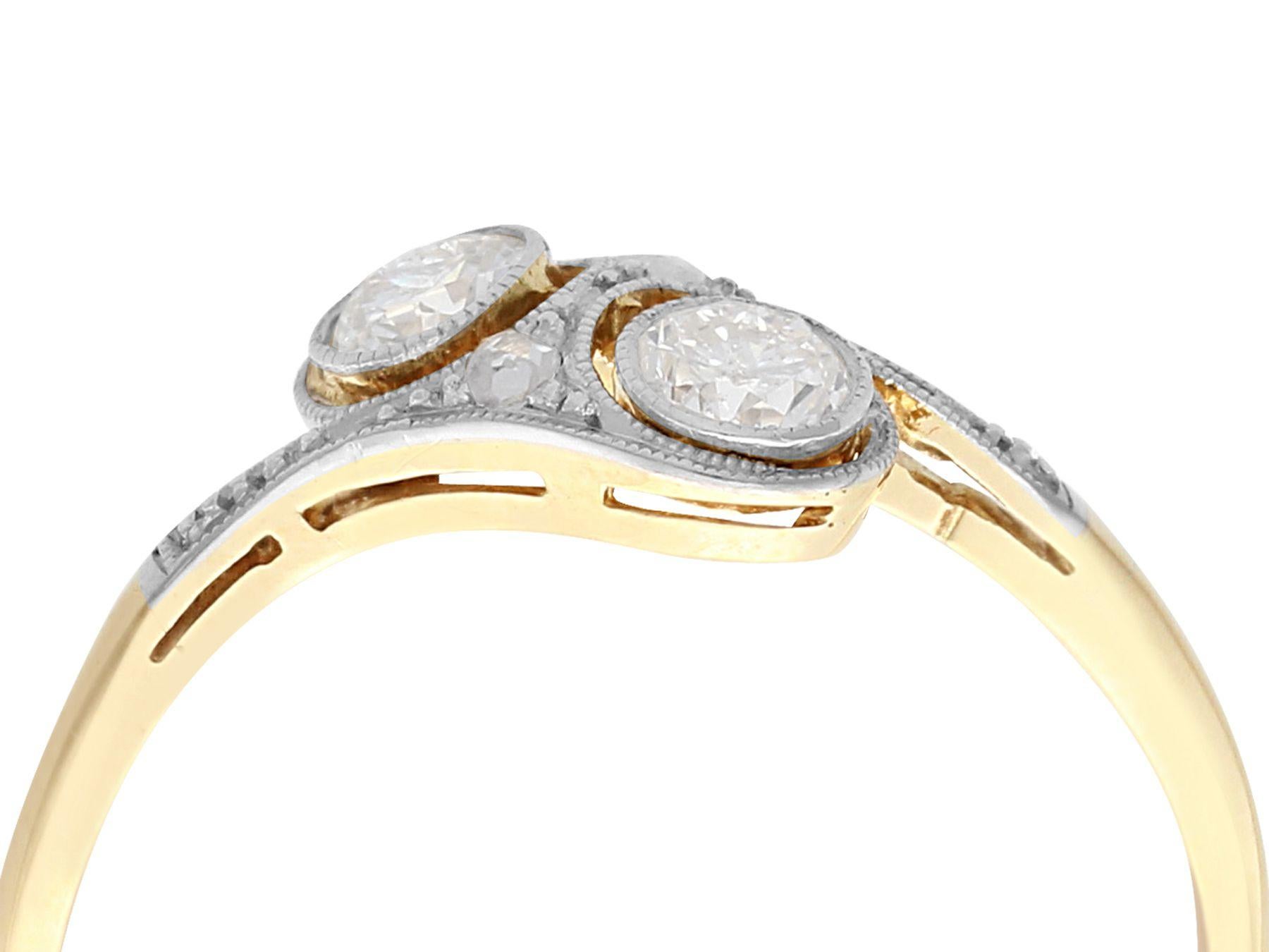 An impressive antique 0.40 carat diamond and 14 karat yellow gold, 14 karat white gold twist style cocktail ring; part of our diverse antique jewelry and estate jewelry collections.

This fine and impressive antique diamond twist ring has been