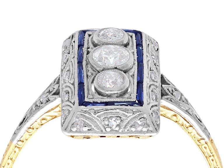 An impressive antique Art Deco 0.37 carat diamond, 0.16 carat sapphire and 14 karat gold cocktail ring; part of our diverse antique jewelry collections.

This fine and impressive 1920s Art Deco diamond and sapphire ring has been crafted in 14 k