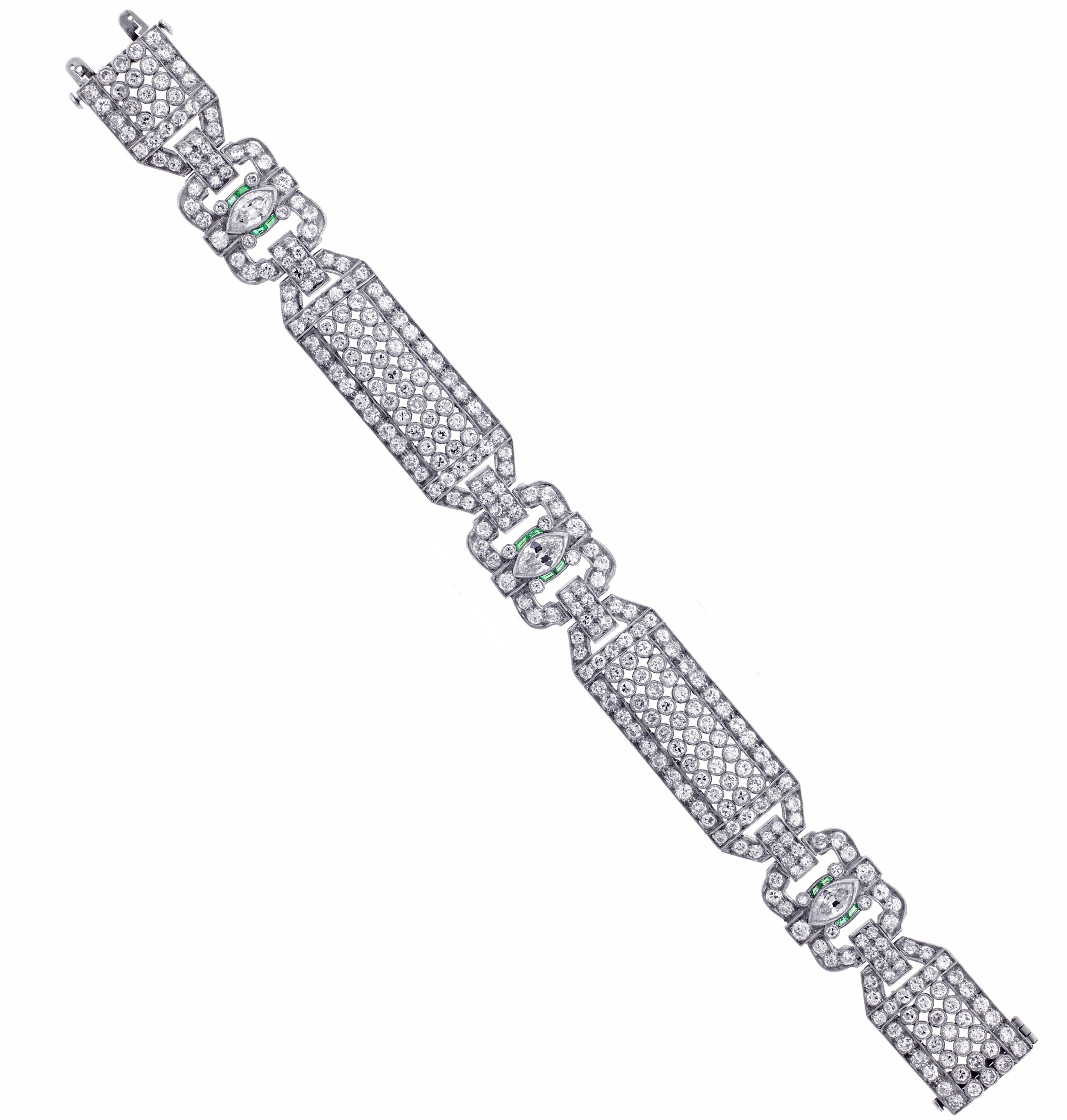  From the Art Deco period, a  17½ carats total weight diamond and emerald bracelet.
♦ Metal: Pltinum
♦ 3 marquise diamonds =1.50 carats I VS/SI1
♦ 212 round diamonds=16 carats H SI1
♦ 12 Emeralds=.20 carats
♦ 5/8s of an inch wide, 7¼ long
♦