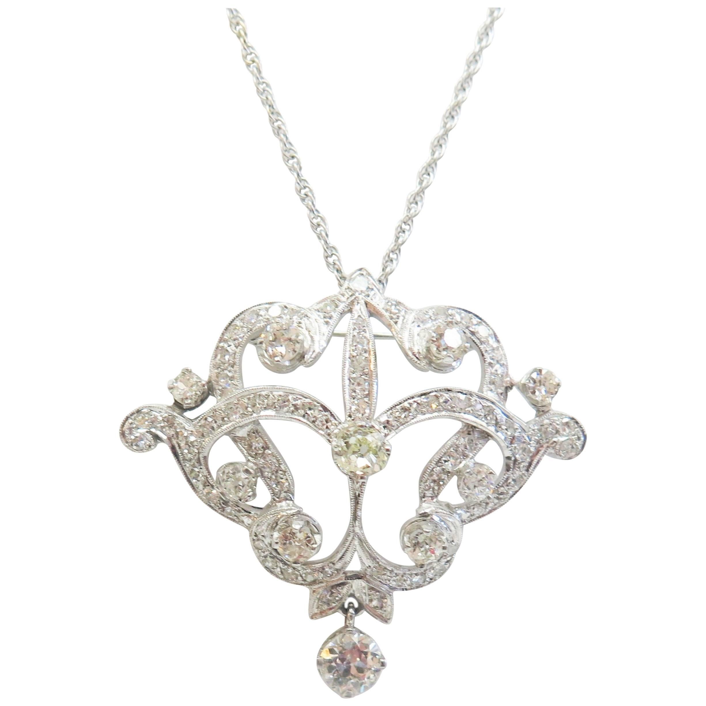 Dripping with sparkling with antique Diamonds, this pin/pendant has 3.67 Carats in Diamonds. A wonderful pendant from the Art Nouveau (circa 1920) era! 

There are 82 diamonds total.
Seven are Old European Cut, weights as follows:
2 approx. 0.11