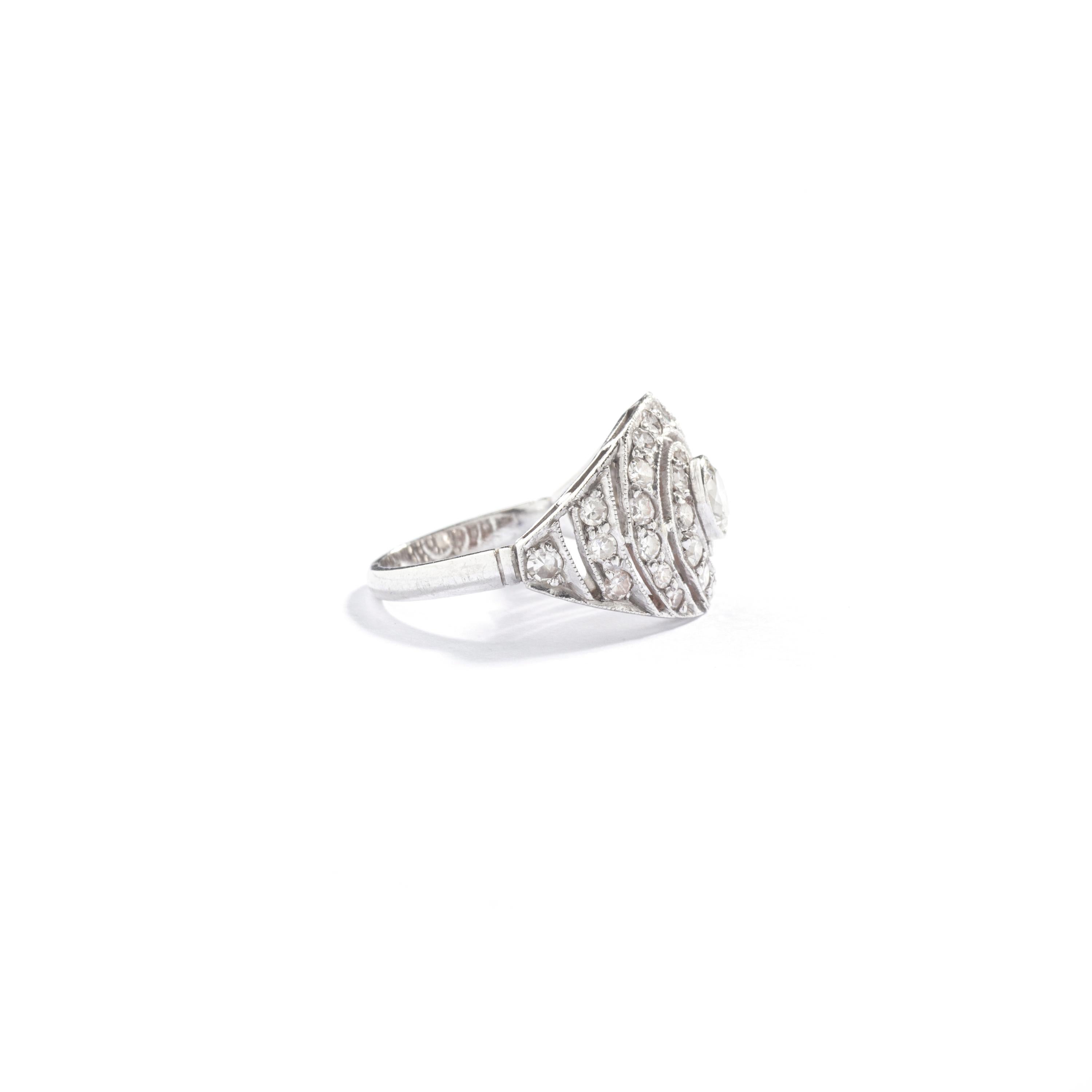 This exquisite art deco engagement ring is the perfect gift for someone seeking a unique and rare piece. Crafted in platinum, the ring features a stunning diamond twisted design that adds a touch of elegance and sophistication.

Dating back to