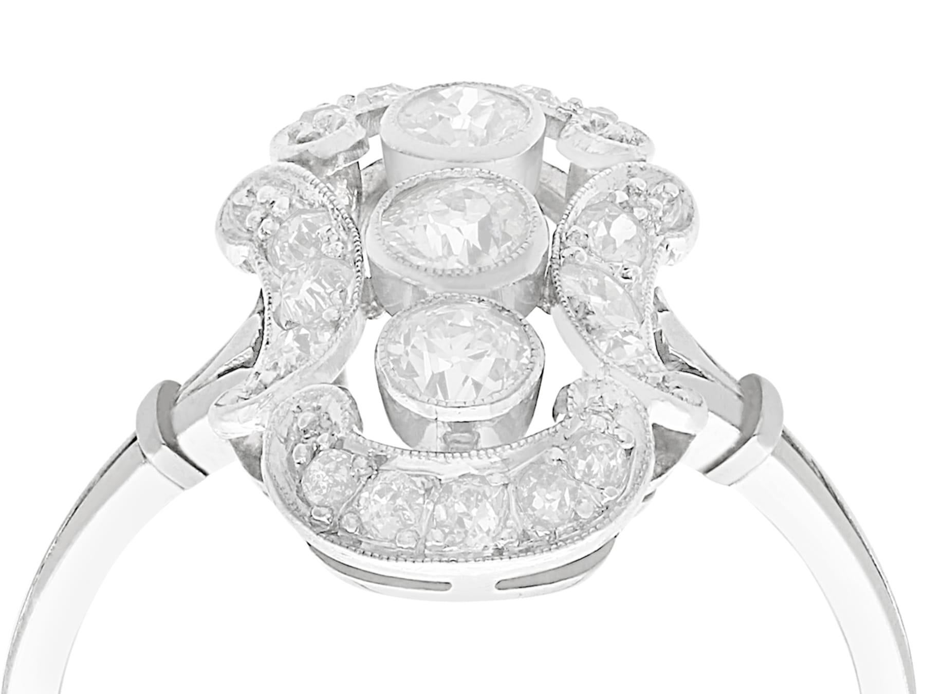 A stunning antique European 0.80 carat diamond and 14 karat white gold dress ring; part of our diverse antique jewelry and estate jewelry collections.

This stunning, fine and impressive 1920s diamond cocktail ring has been crafted in 14k white