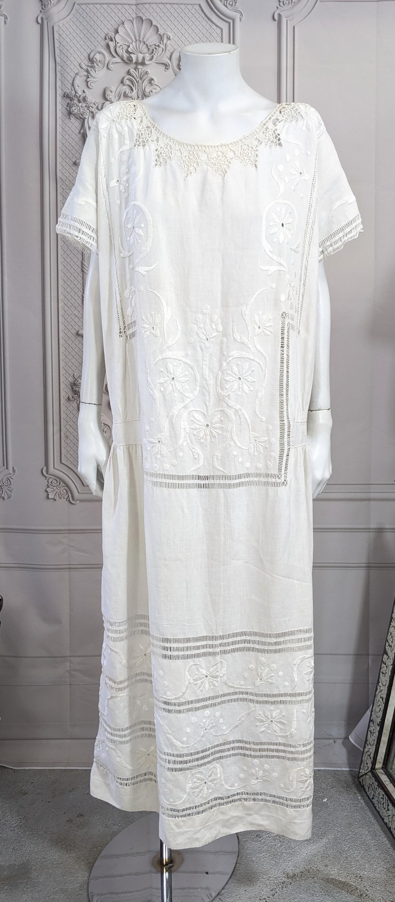 1920's Drop Waist Decorated Linen Dress hand embroidered with floral panels, faggoting and irish crochet open work at neckline. Large easy size, fits like tube with some gathers at hip. Wonderful period hand work. 
1920's USA. Bust 42