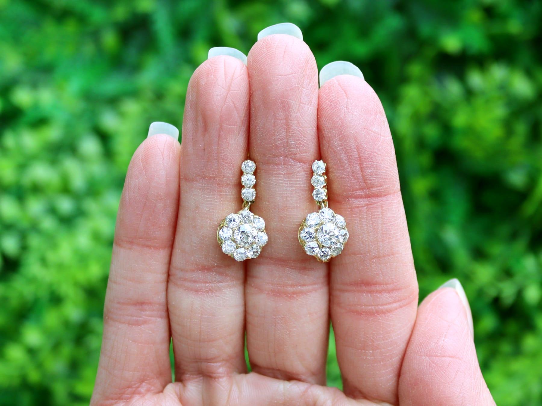 A stunning, fine and impressive pair of antique Dutch 2.35 carat diamond, 14 karat yellow gold and silver set cluster earrings; part of our diverse floral jewellery collections.

These stunning, fine and impressive antique diamond earrings have been