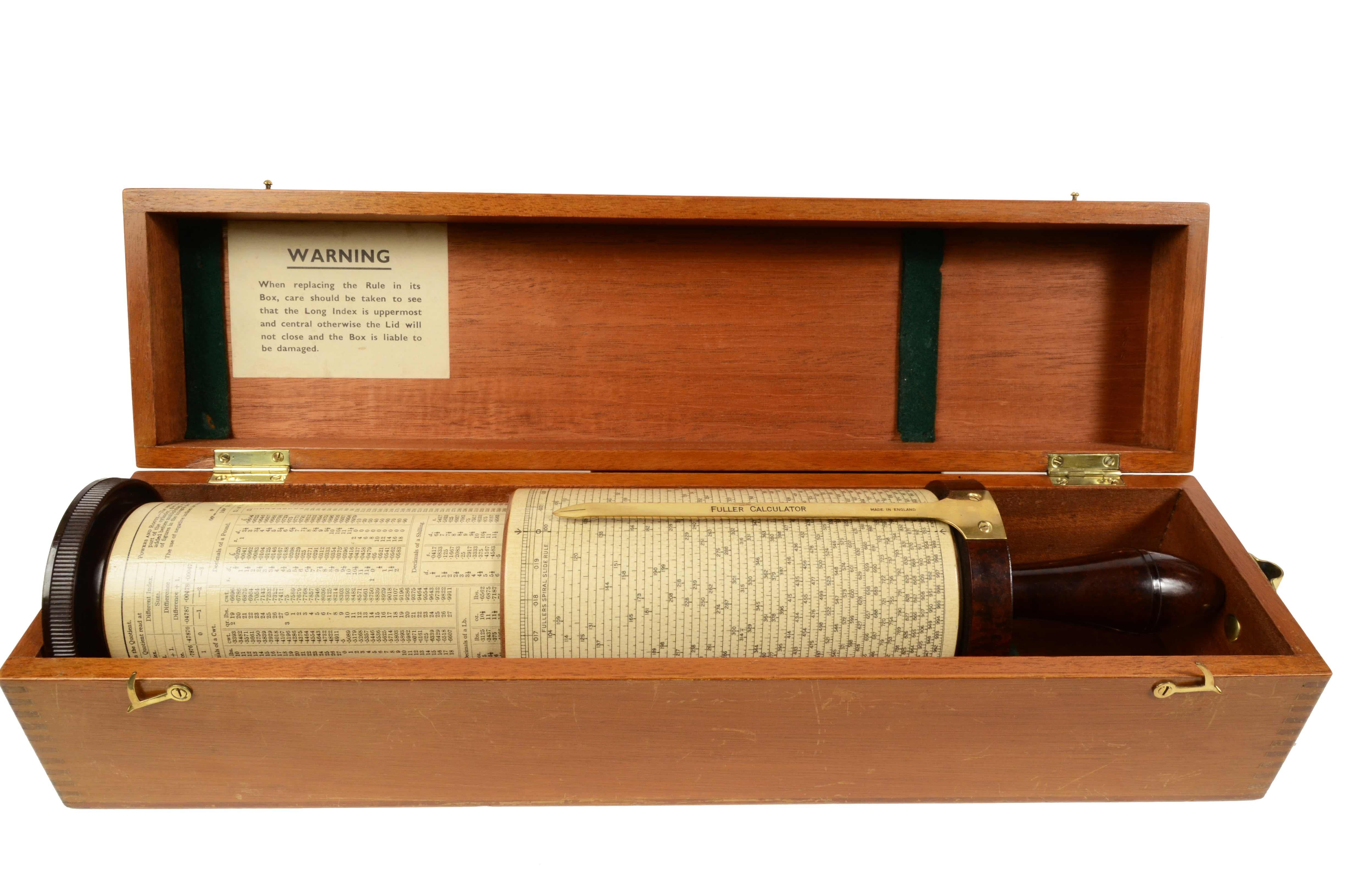 Antique ebonite brass and papier maché spiral slide-rule, conceived by George Fuller from Belfast, engineering professor in Queen’s University in London in 1878, made by STANLEY in the early 1920s; it is located in its original mahogany box. Very