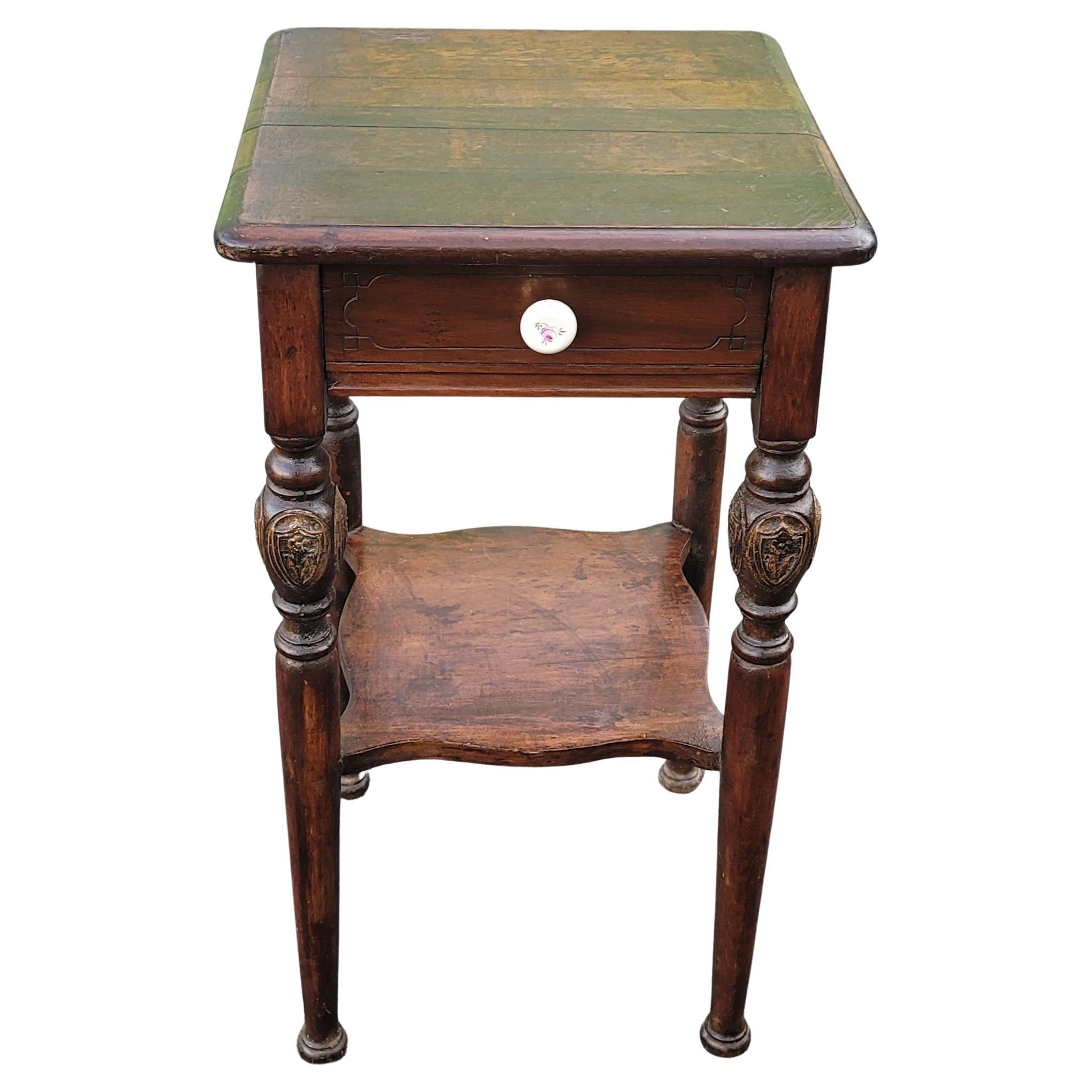 A rare patinated two tier Edwardian side table with one drawer and  shelf. 