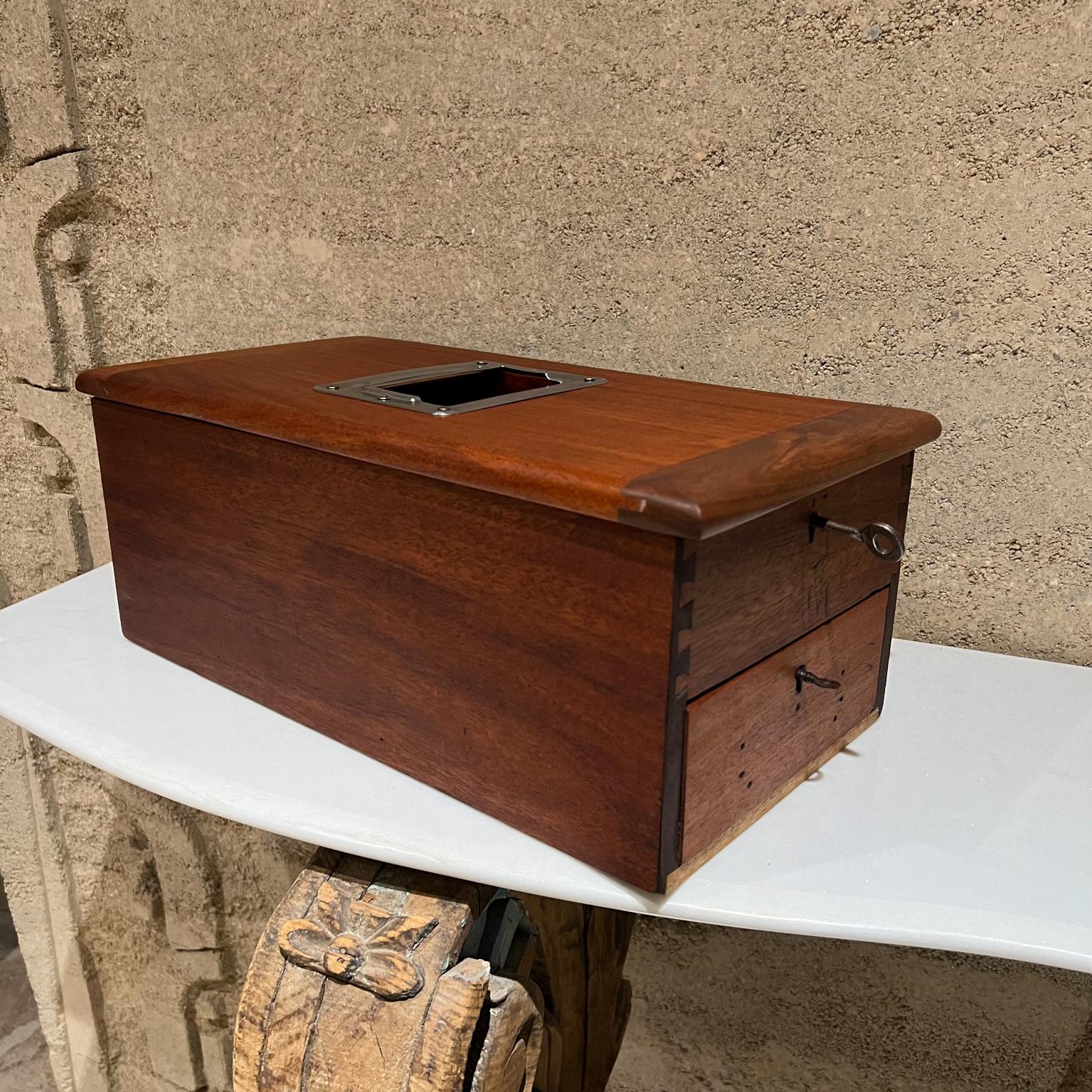 1920s Elegant antique wood money box USA (pre–ATM Venmo PayPal!)
Beautiful craftsmanship
Measures: 7 tall x 9.25 width x 17.5 depth
Solid wood with chrome plated window cover. It has two keys.
Tested and working.
Original finish was refreshed.