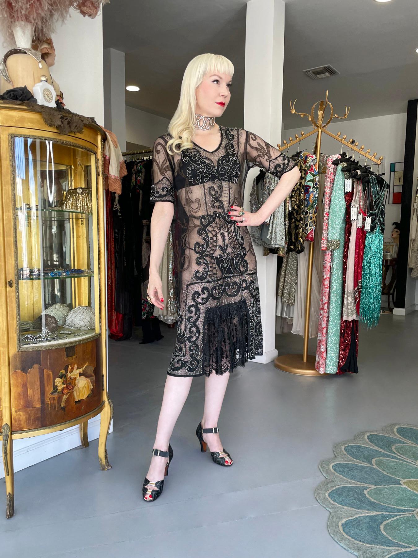 There are lots of lovely antique garments still around, but every once in a while I come across one that is definitely a showstopper. This is an extraordinarily beautiful 1920's sheer black mixed lace dance dress in stunning wearable condition which