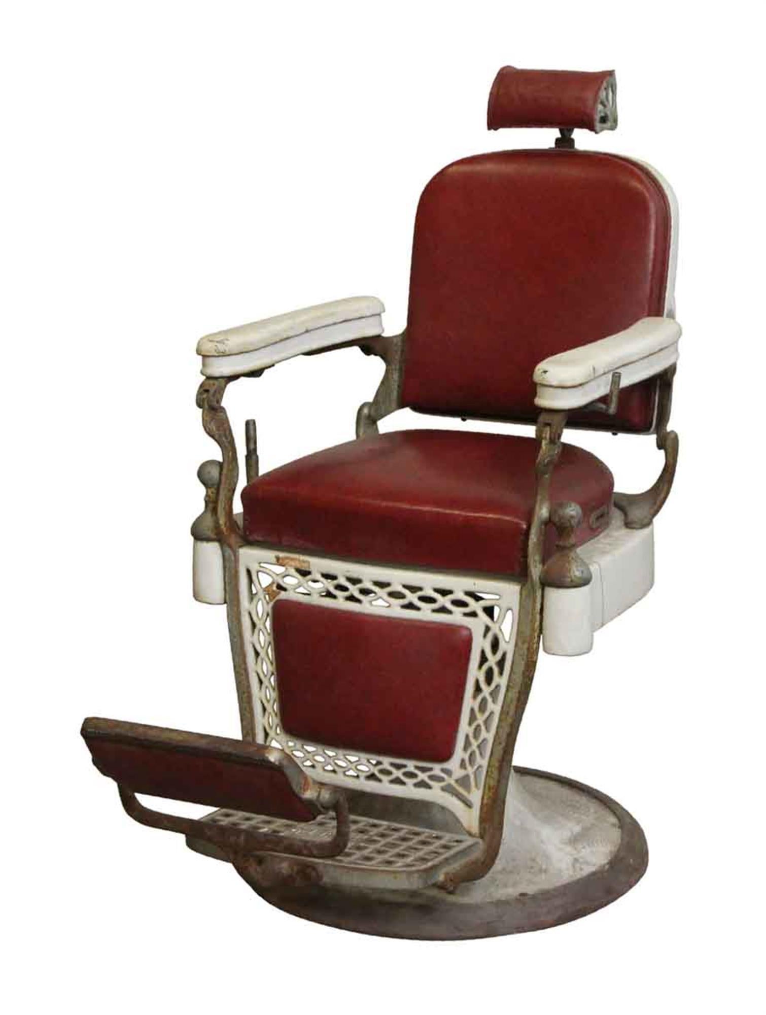 Old 1920s barber chair in restorable condition with porcelain arms and burgundy red upholstery. Made by The Emil J. Paidar Company. Needs some restoration. This can be seen at our 400 Gilligan St location in Scranton, PA.