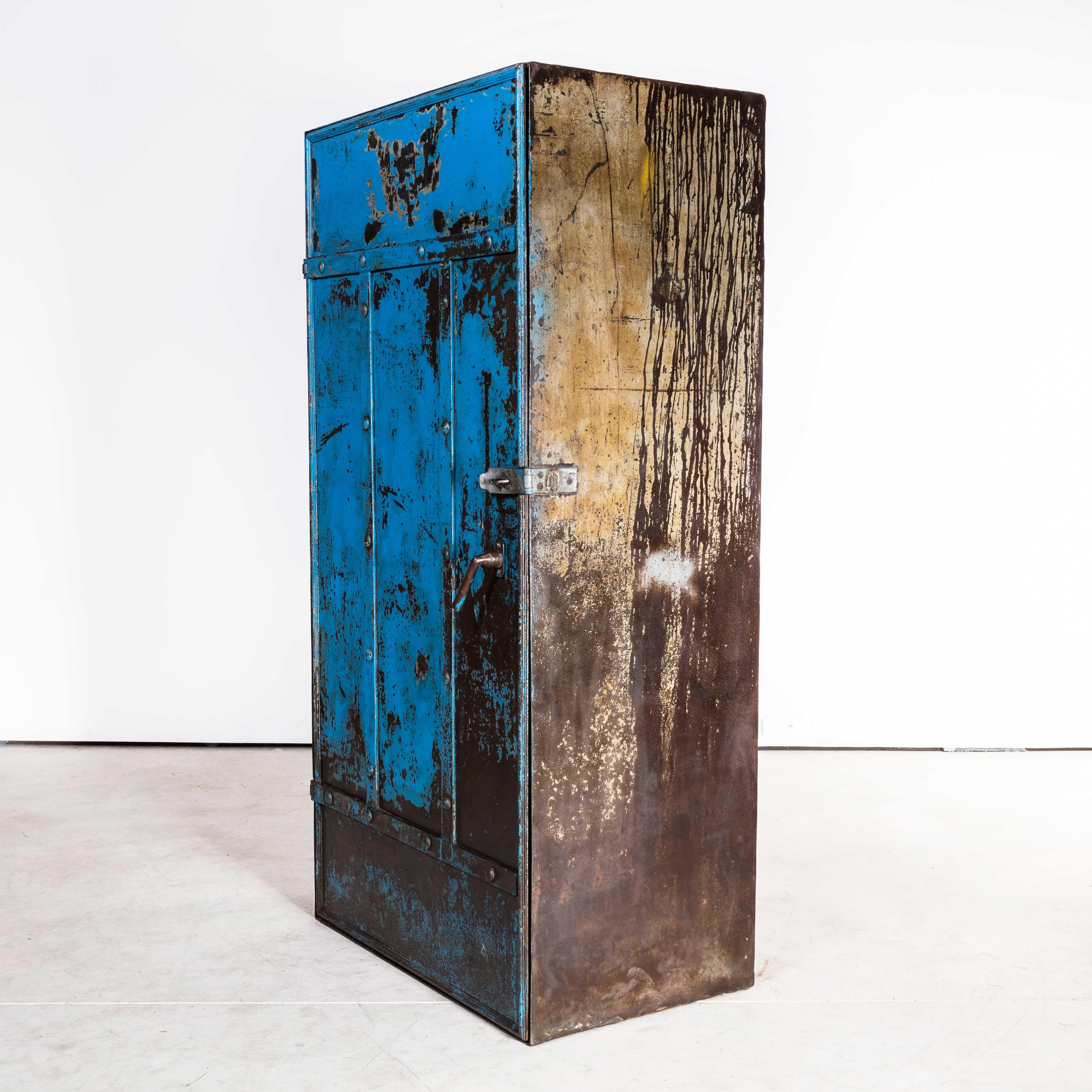 1920s English Industrial Strong Locker
1920s English Industrial Strong Locker – Sourced in Lancashire from a machine parts tool maker it is a heavy secure cabinet used to hold master tool guides. The door has heavy duty steel strapping and the