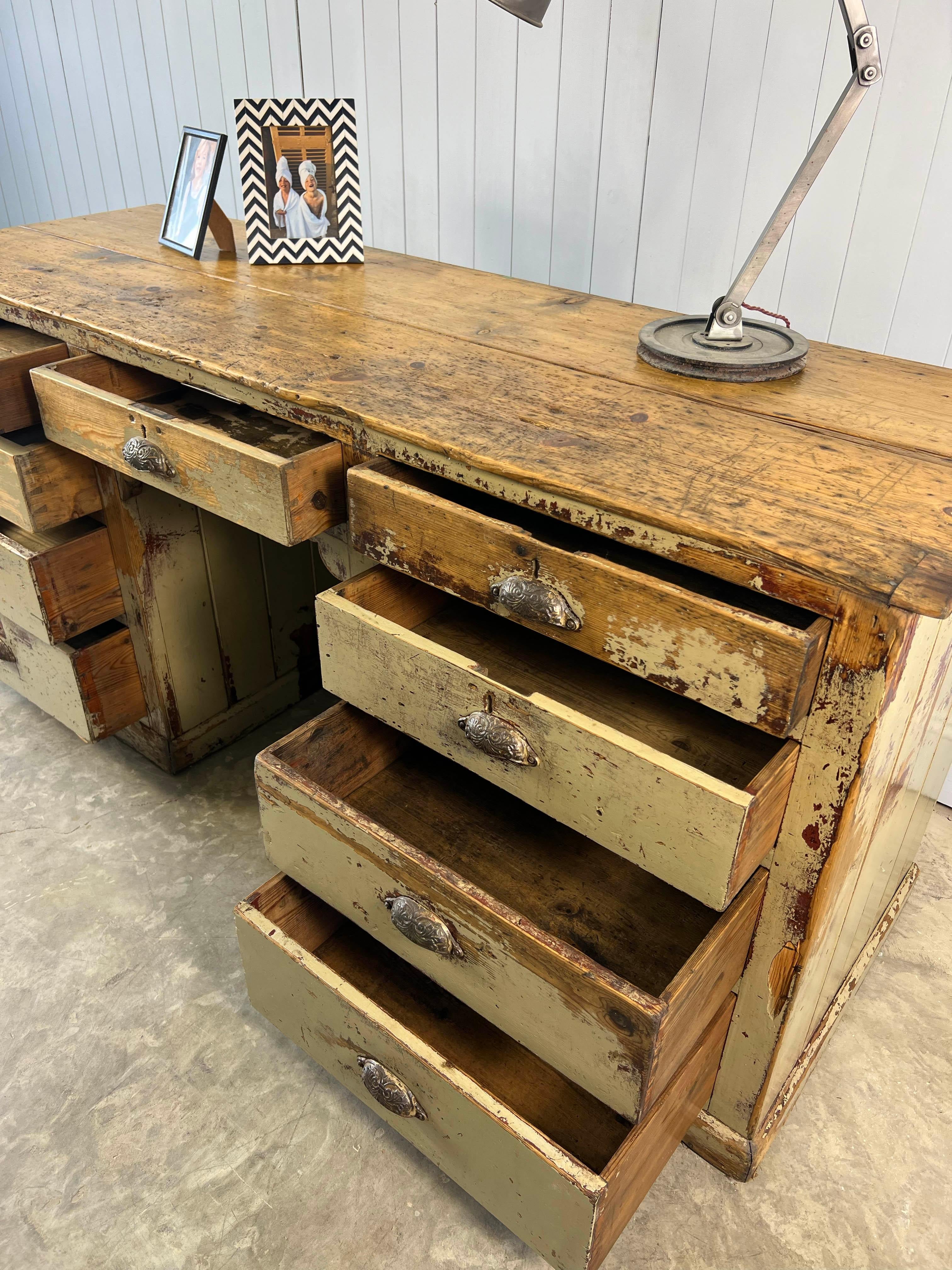 This antique desk was sourced from a printers in Nottingham.  It would have held the metal blocks used for type setting. The wood is pine with brass decorative cup handles.

It has a lovely vintage industrial feel to it.

All the drawers are in good