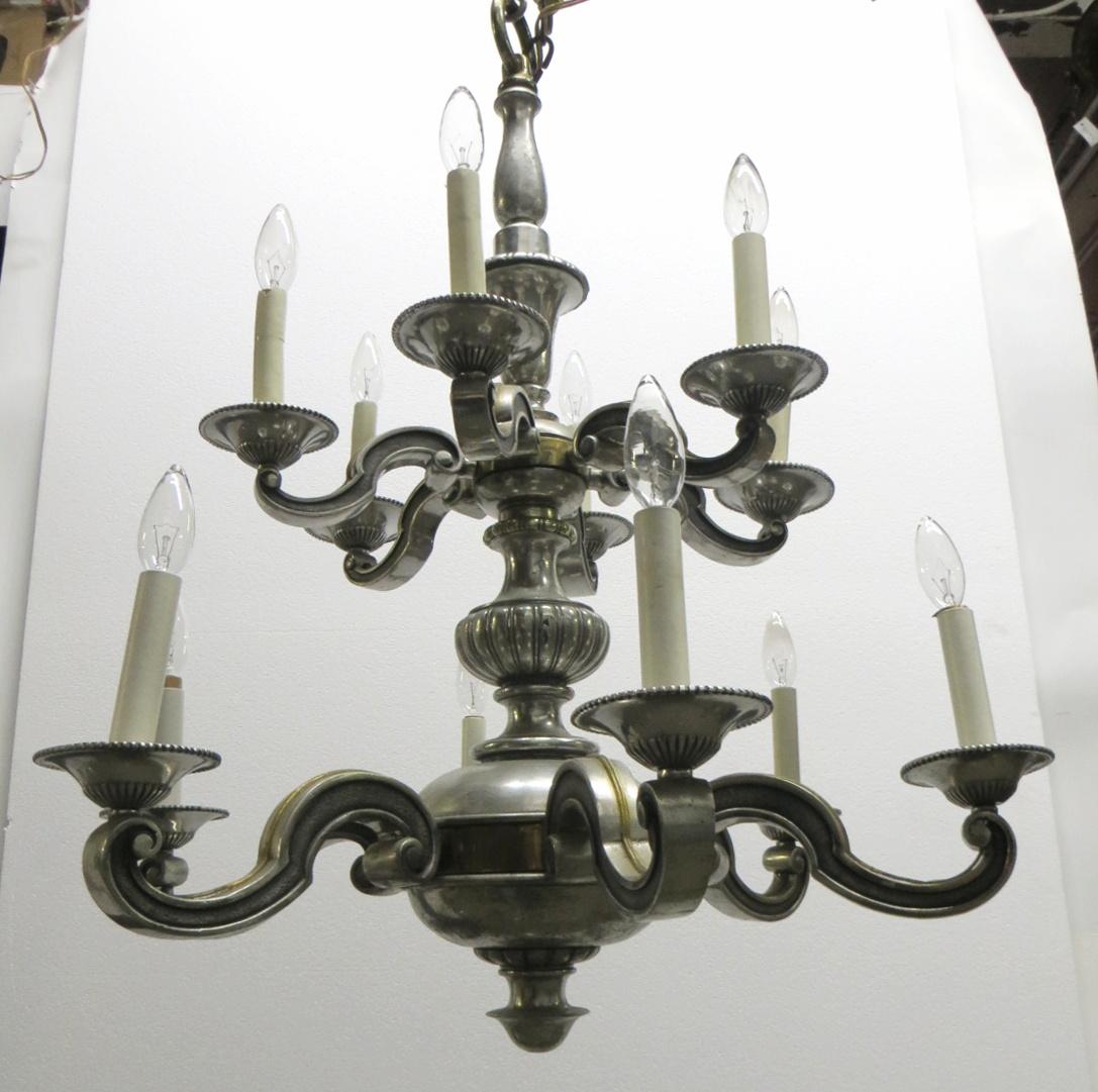 English Georgian style bronze chandelier with 12 arms total and a silvered finish, circa 1920. Cleaned and rewired. Please note, this item is located in our Los Angeles location.