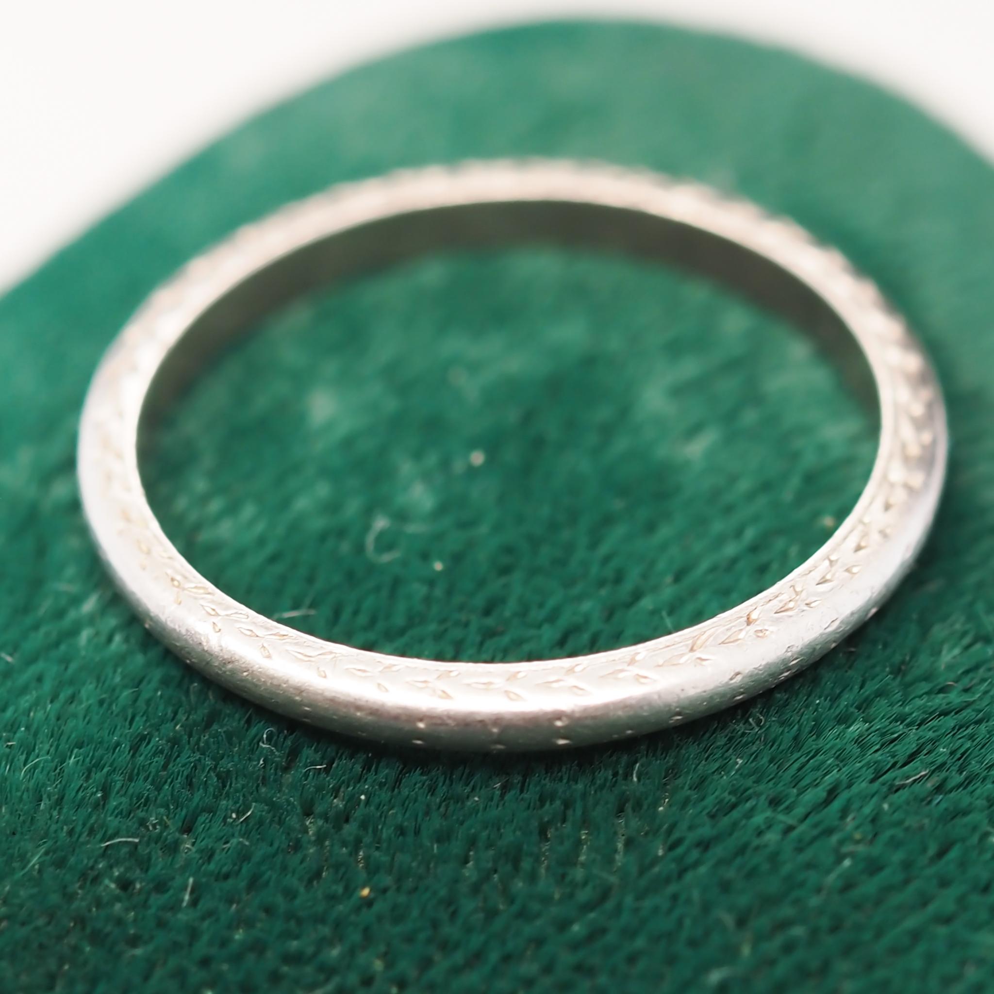 Year: 1920s

Item Details:
Ring Size: 4.75
Metal Type: Platinum [Hallmarked, and Tested]
Weight: 2.3 grams

Band Width: 1.9 mm
Condition: Excellent

