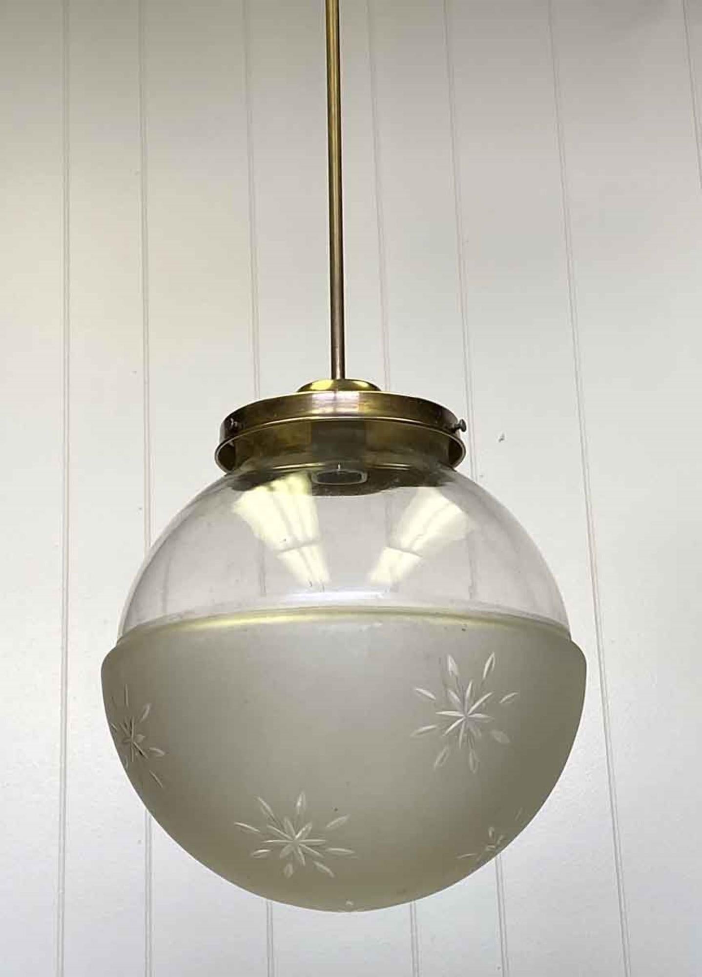 1920s etched glass globe fitted with a slender new brass pole fixture. Please note, this item is located in our Scranton, PA location.