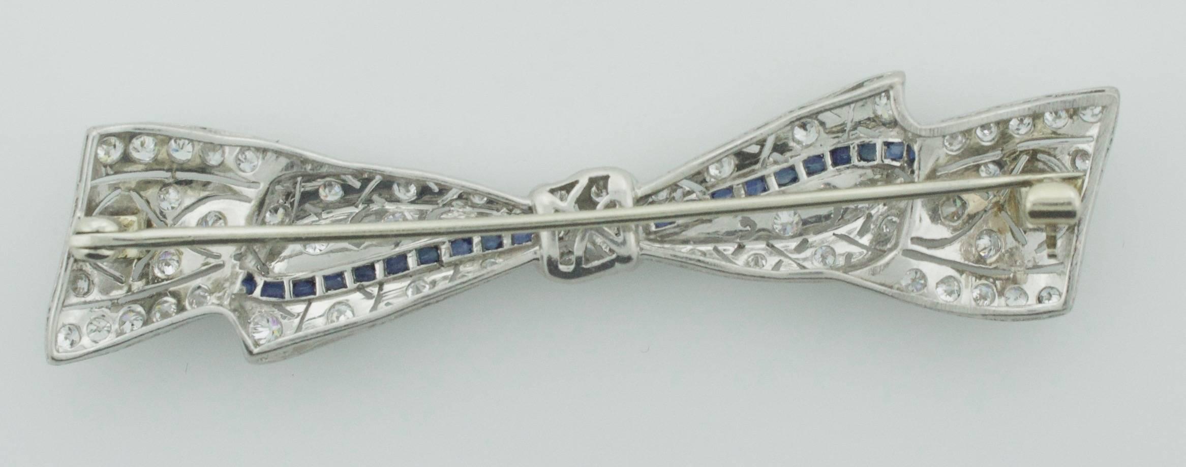 Old European Cut 1920s Exquisite Platinum Diamond and Sapphire Bow Brooch For Sale