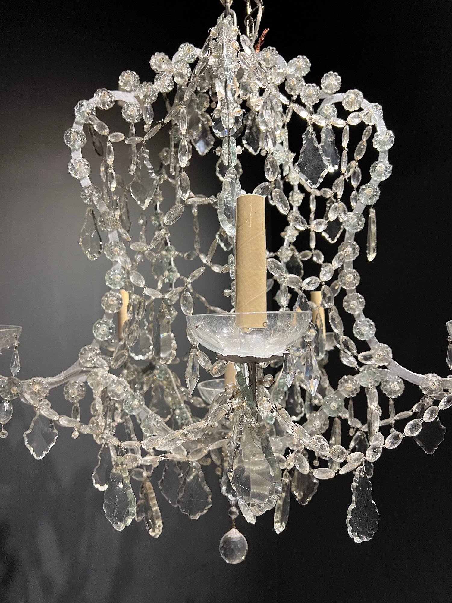 A circa 1920’s French silvered metal chandelier with crystals hangings 