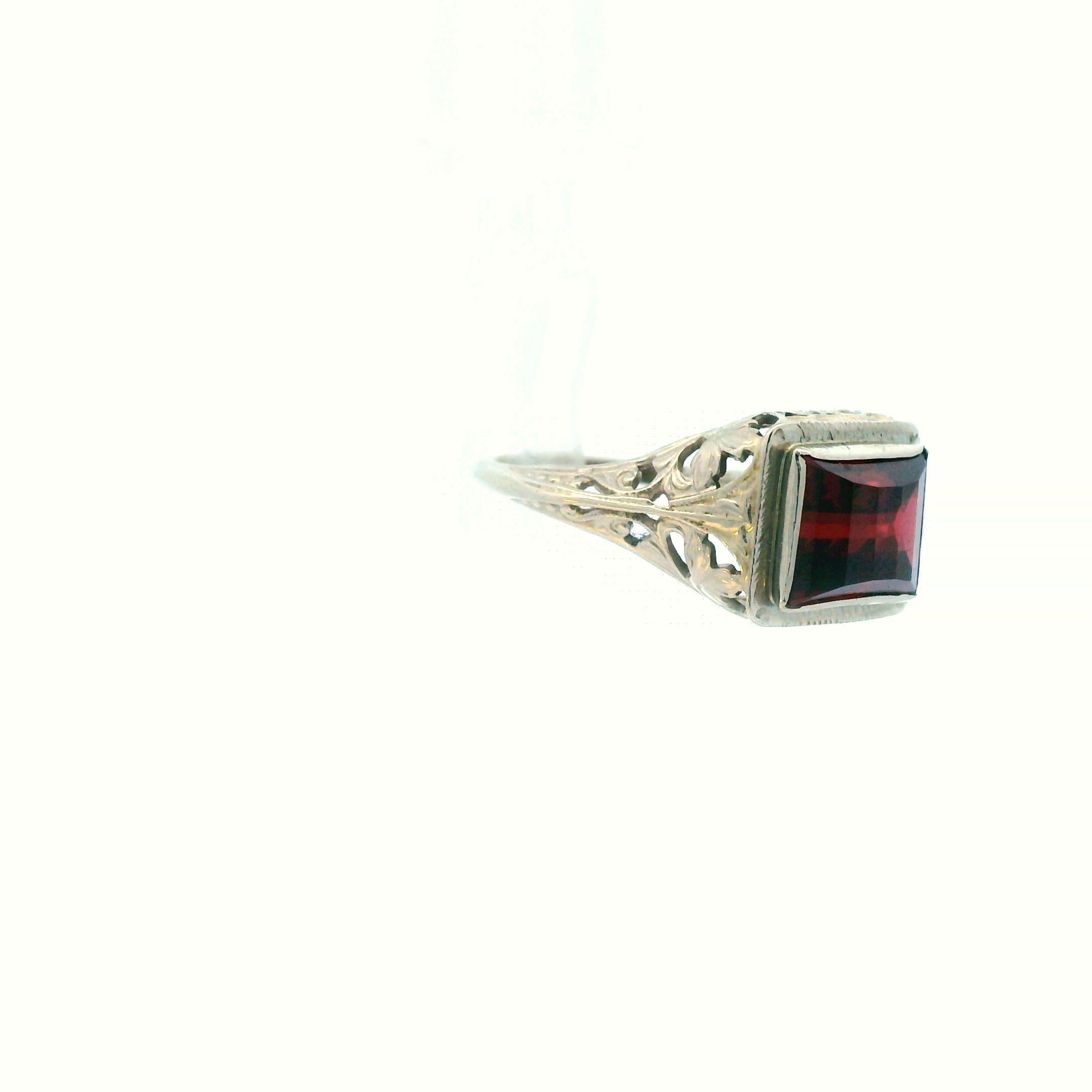This lovely ring from the 1920s is a 14k white gold filigree garnet ring. Garnet has long been associated with giving its wearer power as well as shield the wearer from hard, making this ring the perfect sentimental gift for a special friend or