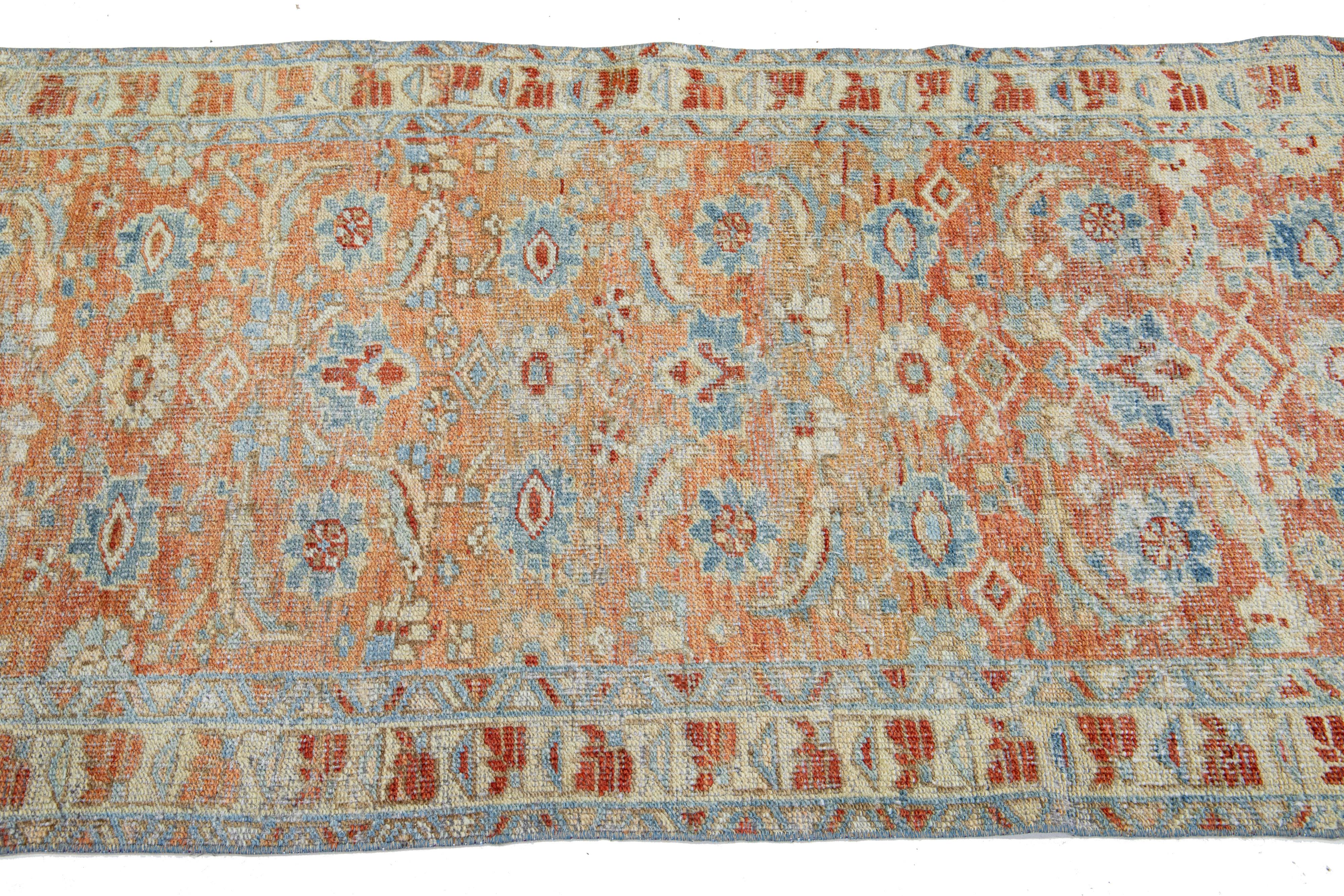 Persian 1920s Floral Antique Heriz Handmade Wool Runner with Rust Field For Sale