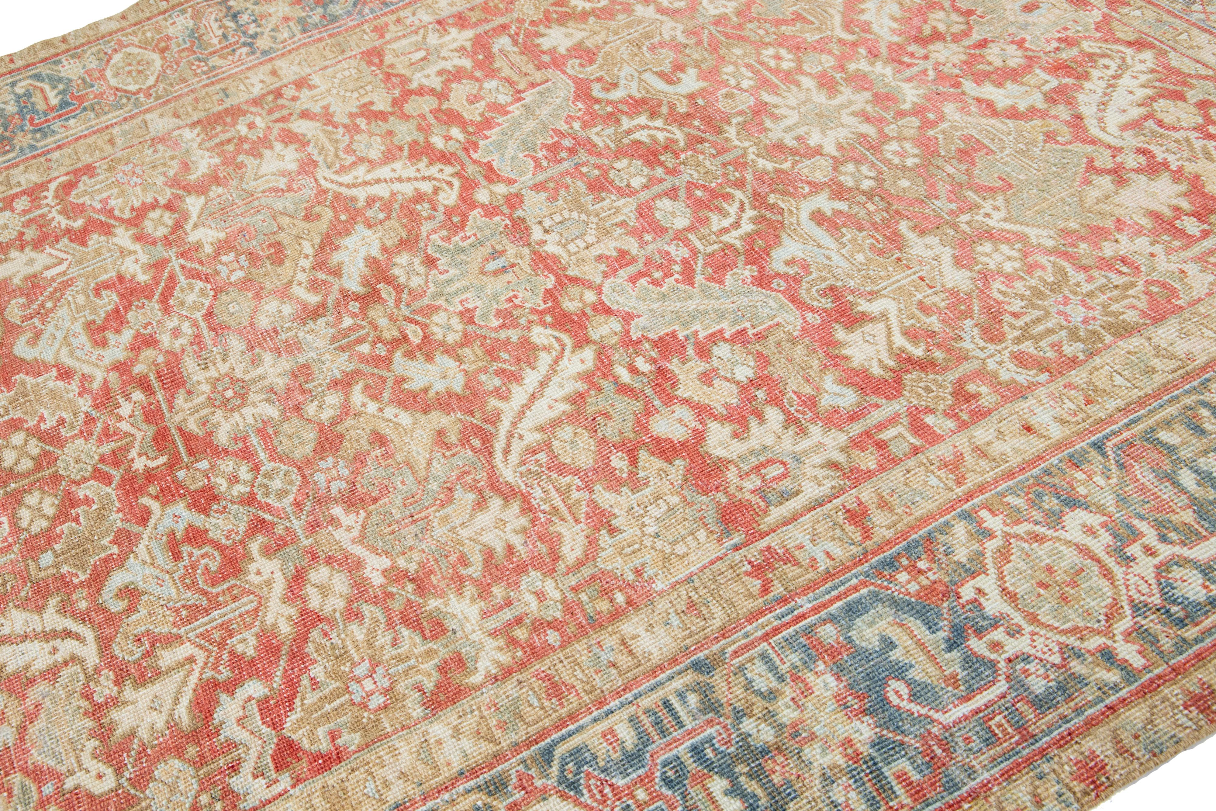 Heriz Serapi 1920s Floral Antique Persian Heriz Wool Rug Featuring a Rust color For Sale