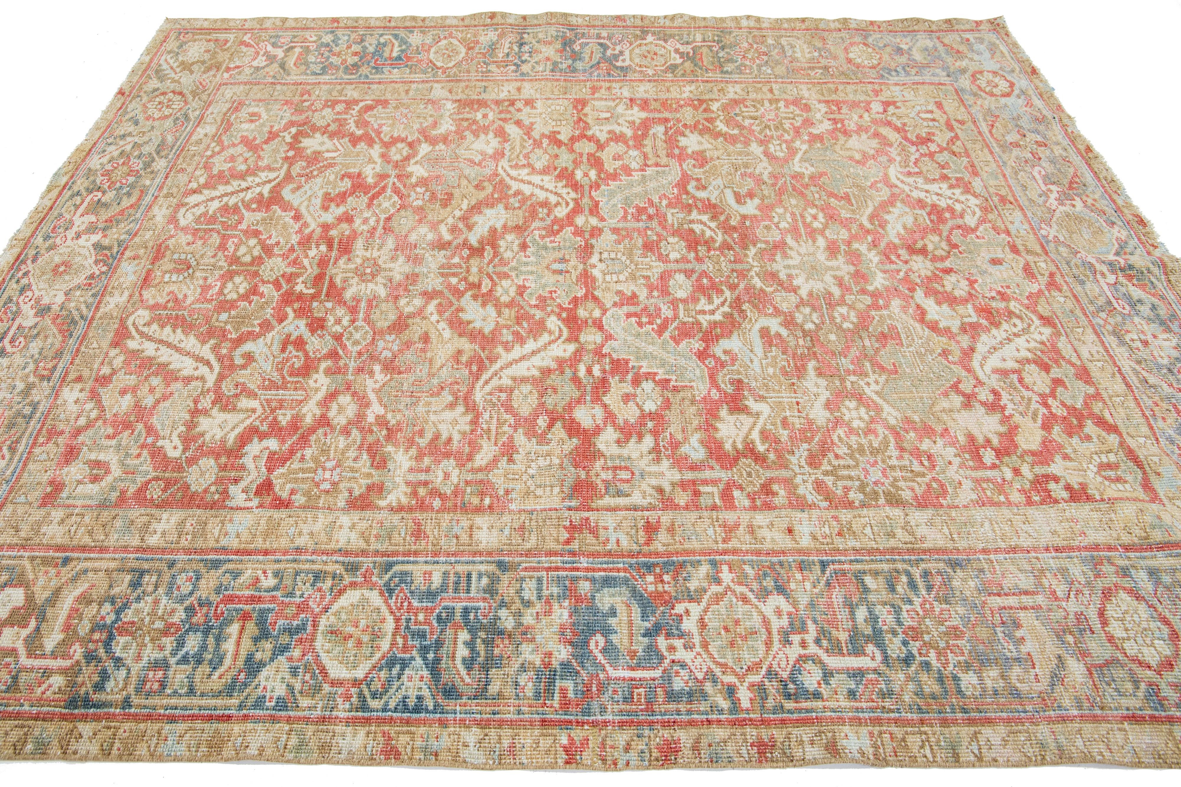 Hand-Knotted 1920s Floral Antique Persian Heriz Wool Rug Featuring a Rust color For Sale