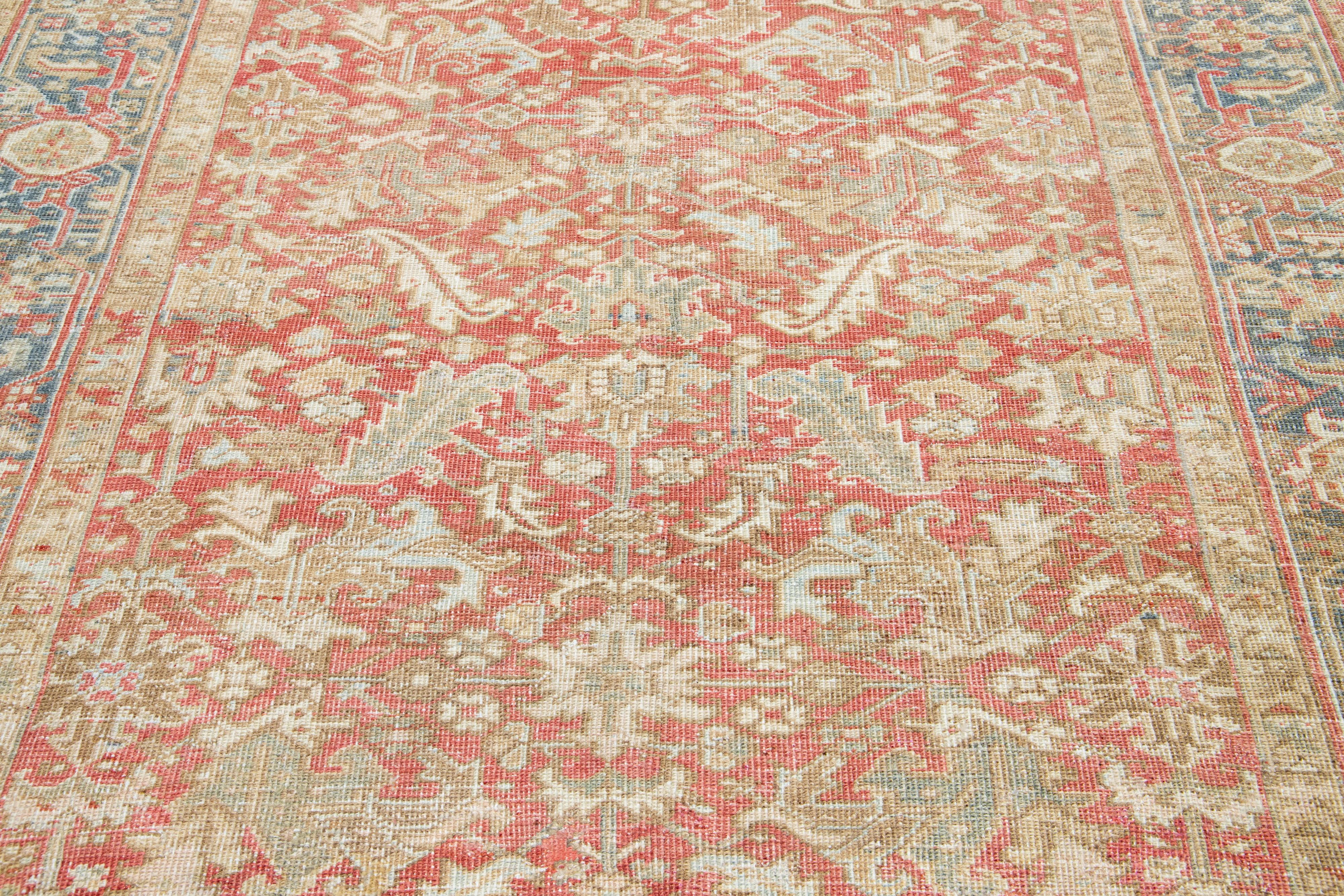 Early 20th Century 1920s Floral Antique Persian Heriz Wool Rug Featuring a Rust color For Sale
