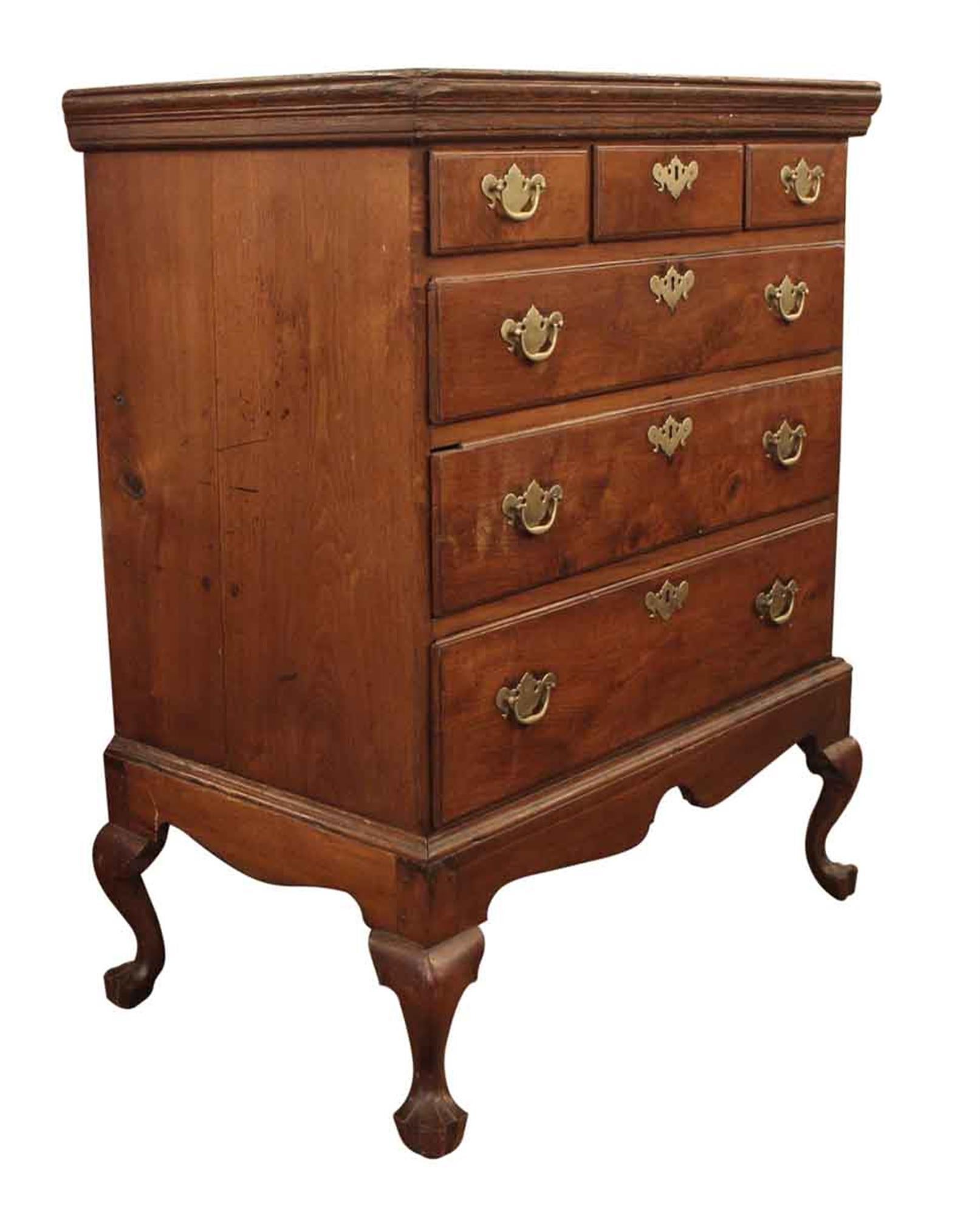 Wooden highboy dresser with six drawers. This charming piece has a nice patina and Chippendale hardware. The highboy top has been removed and the item shows some general wear from age and use. This can be seen at our 400 Gilligan St location in