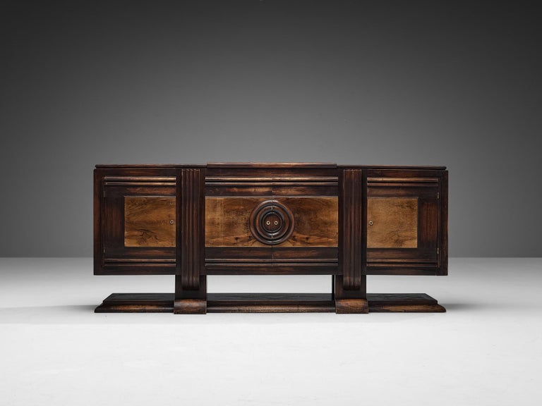 Art Deco sideboard, dark stained ash, walnut, brass, France, late 1920s. 

Antique Art Deco credenza that is definitely unique on its own way. Executed in the finest ash and walnut wood, this piece of furniture radiates quality. An intruiging