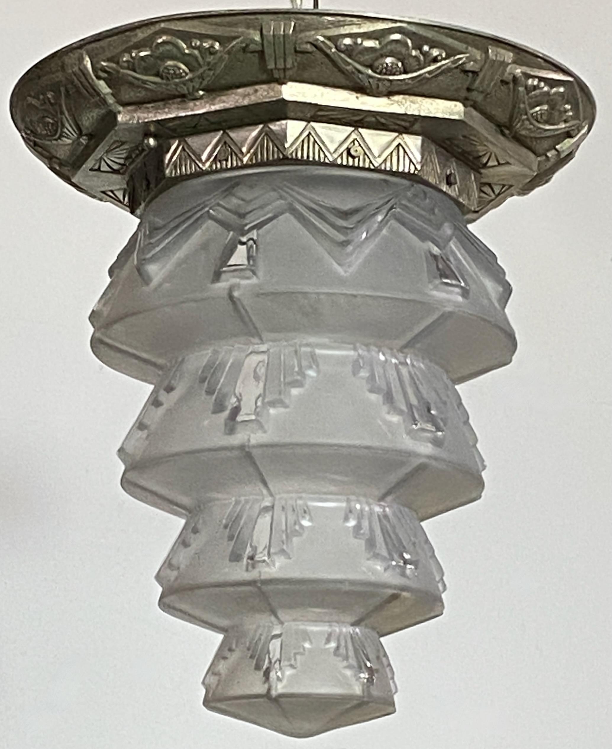 Original Art Deco French flush mount light fixture.
Nickel plated cast metal mounting with frosted glass shade.
This could be adapted to hang from a chain or a rod if desired.
23 inch length with chain.
Shade measures 9 inches high.
Recently